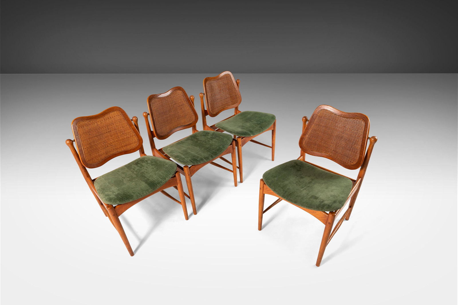 Set of Four (4) Dining Chairs Attributed to Arne Vodder w/ Cane Detailing c. 1960s: Set of Four (4) Dining Chairs Attributed to Arne Vodder w/ Cane Detailing c. 1960s About: Constructed with the finest craftsmanship and attention to every detail. The chairs are sculpted from solid oa