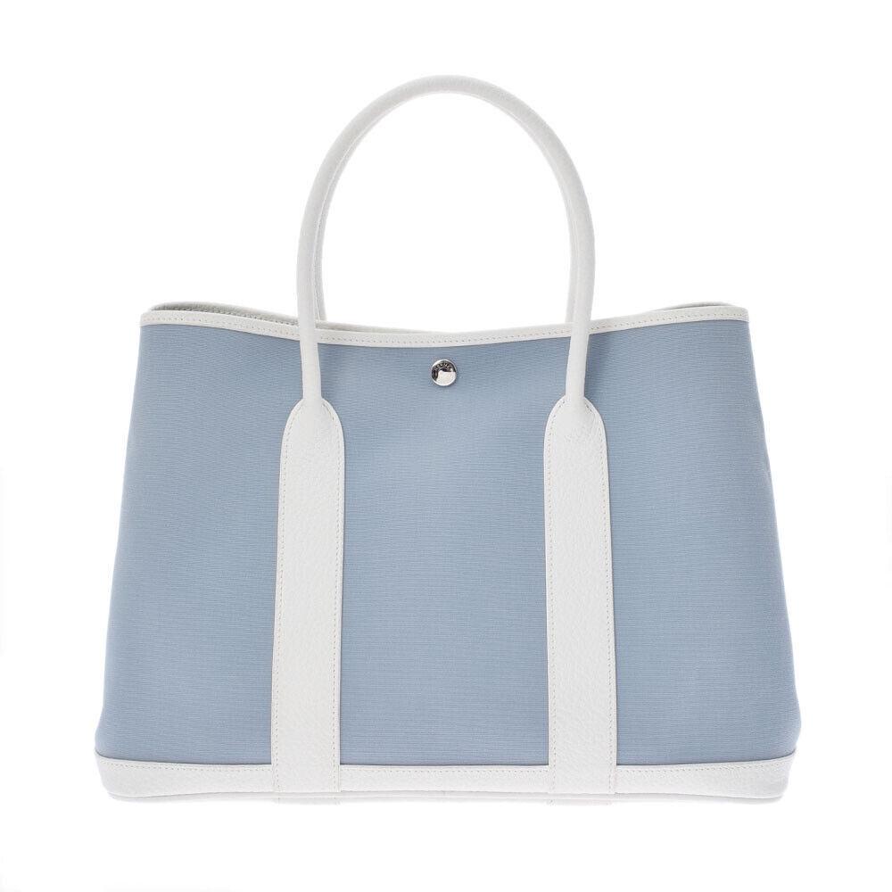 HERMES Garden party PM Blue Lynn Hand Bag: HERMES Garden party PM Blue Lynn Hand Bag Brand: HERMES Style: Hand Bag Exterior Material: Towar Officier Exterior Color: Blue Bag Height: 25cm Bag Depth: 18cm Bag Length: 37cm Type: Handbag B+: Good