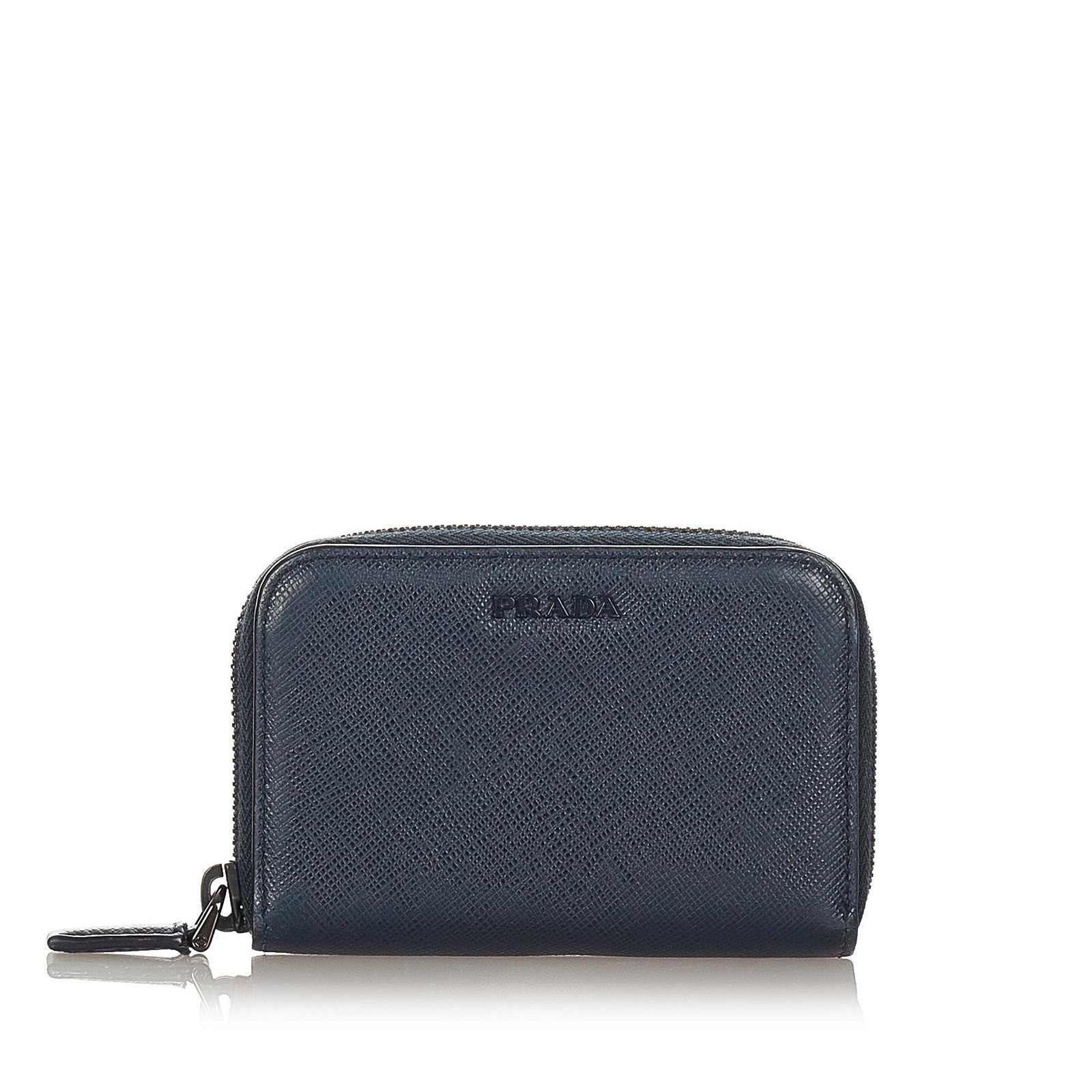 Prada Saffiano Coin Pouch: Prada Saffiano Coin Pouch This coin pouch features a saffiano leather body a zip around closure and interior slip compartments. Brand: Prada Model: Saffiano Coin Pouch Origin: Italy Category: SLG Colo