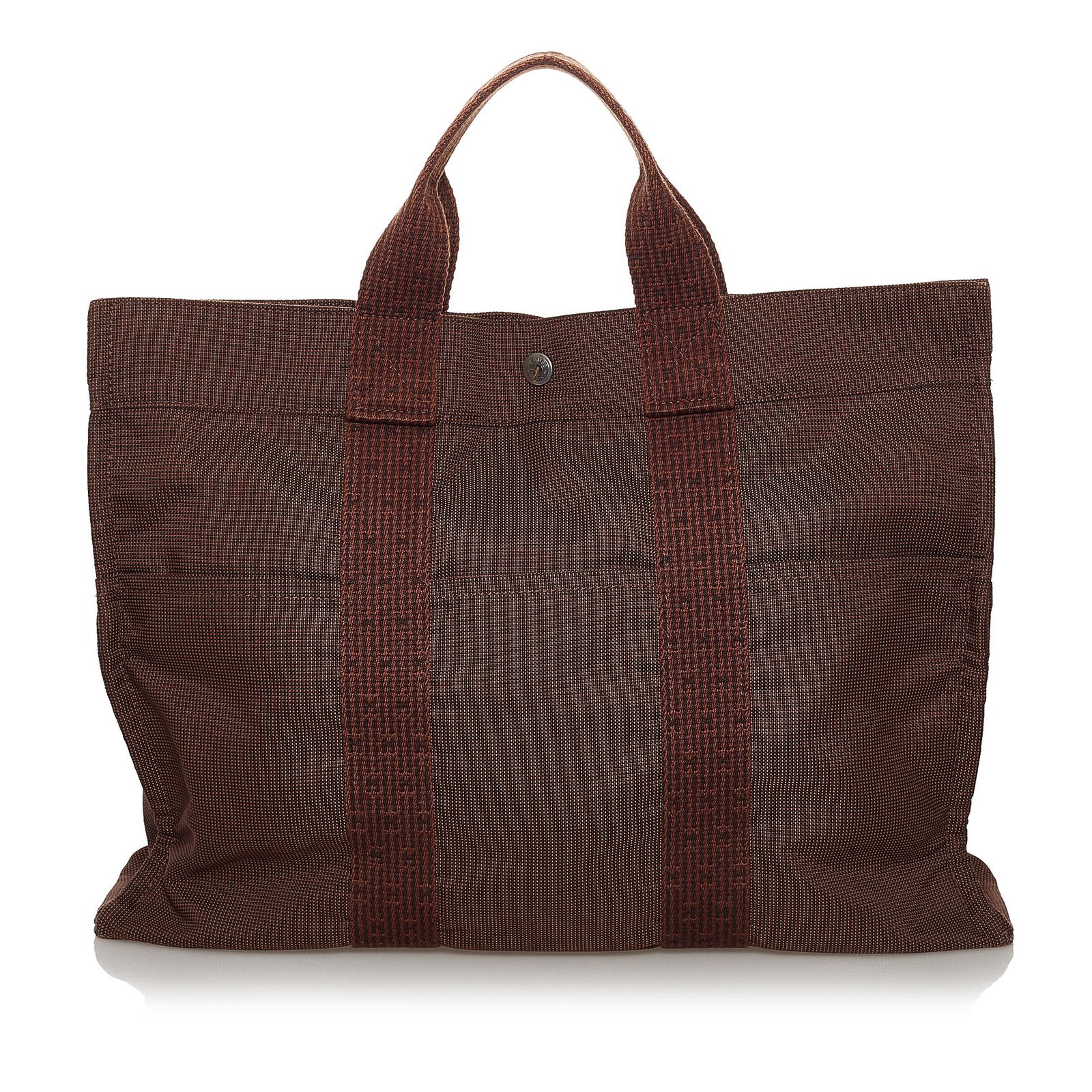 Hermes Herline MM Tote Bag: Hermes Herline MM Tote Bag The Herline MM tote bag features a canvas body exterior front and back slip pockets flat handles a top zip closure and an interior slip pocket. Brand: Hermes Model: Herline