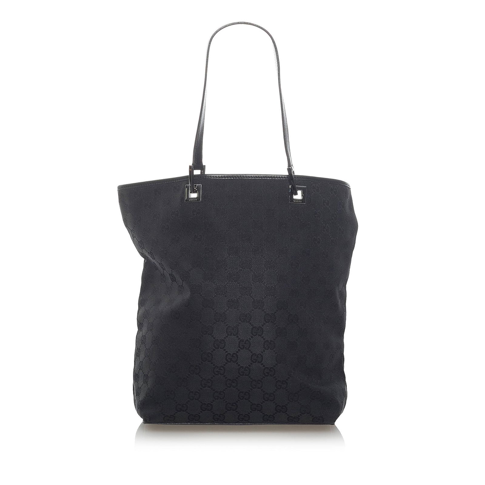 Gucci GG Canvas Tote Bag: Gucci GG Canvas Tote Bag This tote bag features a canvas body flat leather handles an open top and an interior zip pocket. Brand: Gucci Model: GG Canvas Tote Bag Origin: Italy Category: Bags Color: Bl