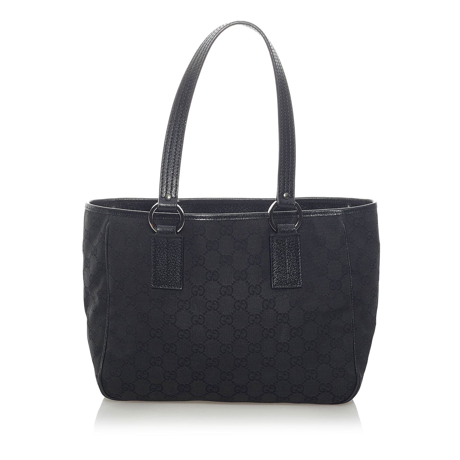 Gucci GG Canvas Handbag: Gucci GG Canvas Handbag This handbag features a canvas body with leather trim flat leather straps an open top and an interior zip pocket. Brand: Gucci Model: GG Canvas Handbag Origin: Italy Category: