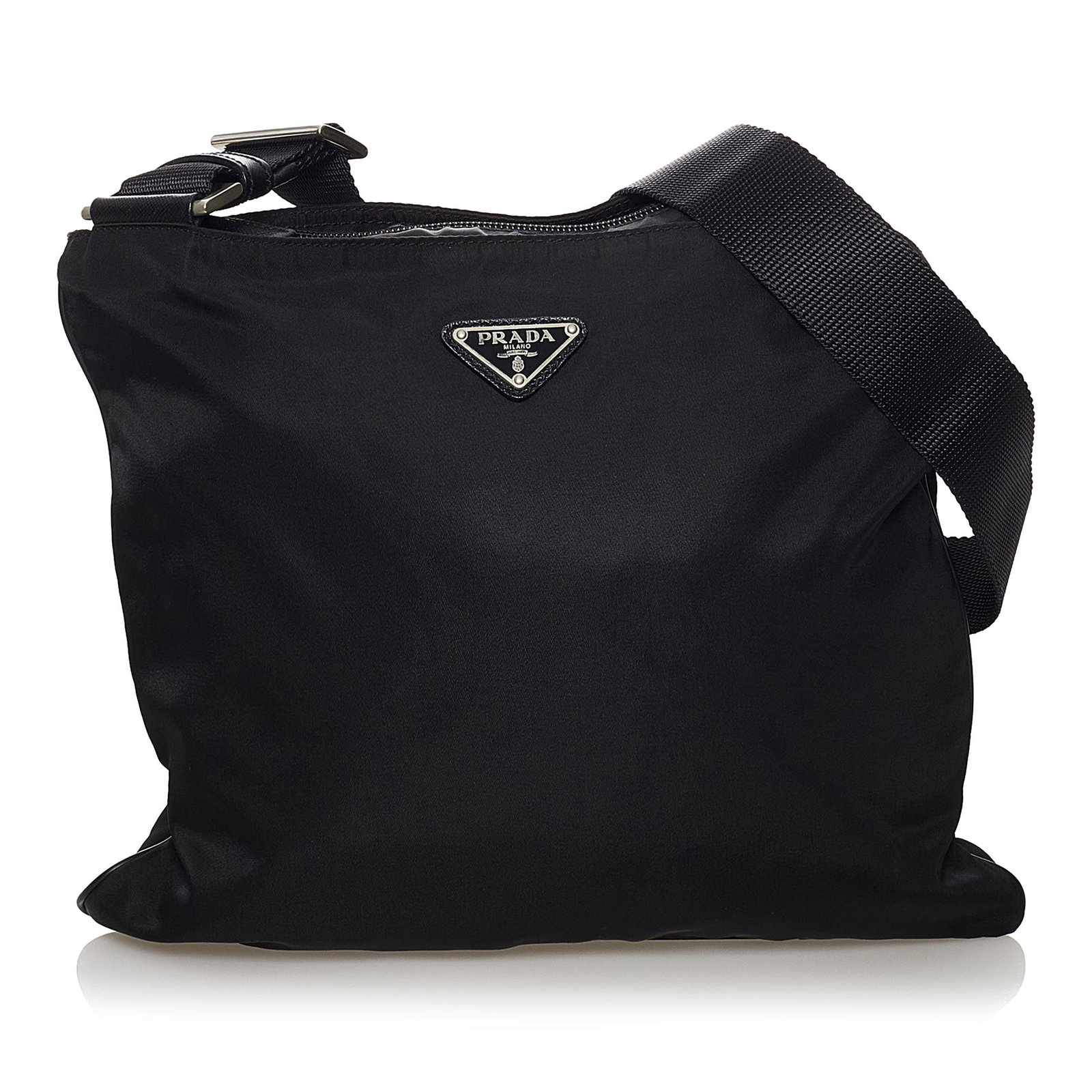 Prada Tessuto Crossbody Bag: Prada Tessuto Crossbody Bag This crossbody bag features a nylon body an adjustable flat strap and a top zip closure. Brand: Prada Model: Tessuto Crossbody Bag Origin: Italy Category: Bags Color: Black