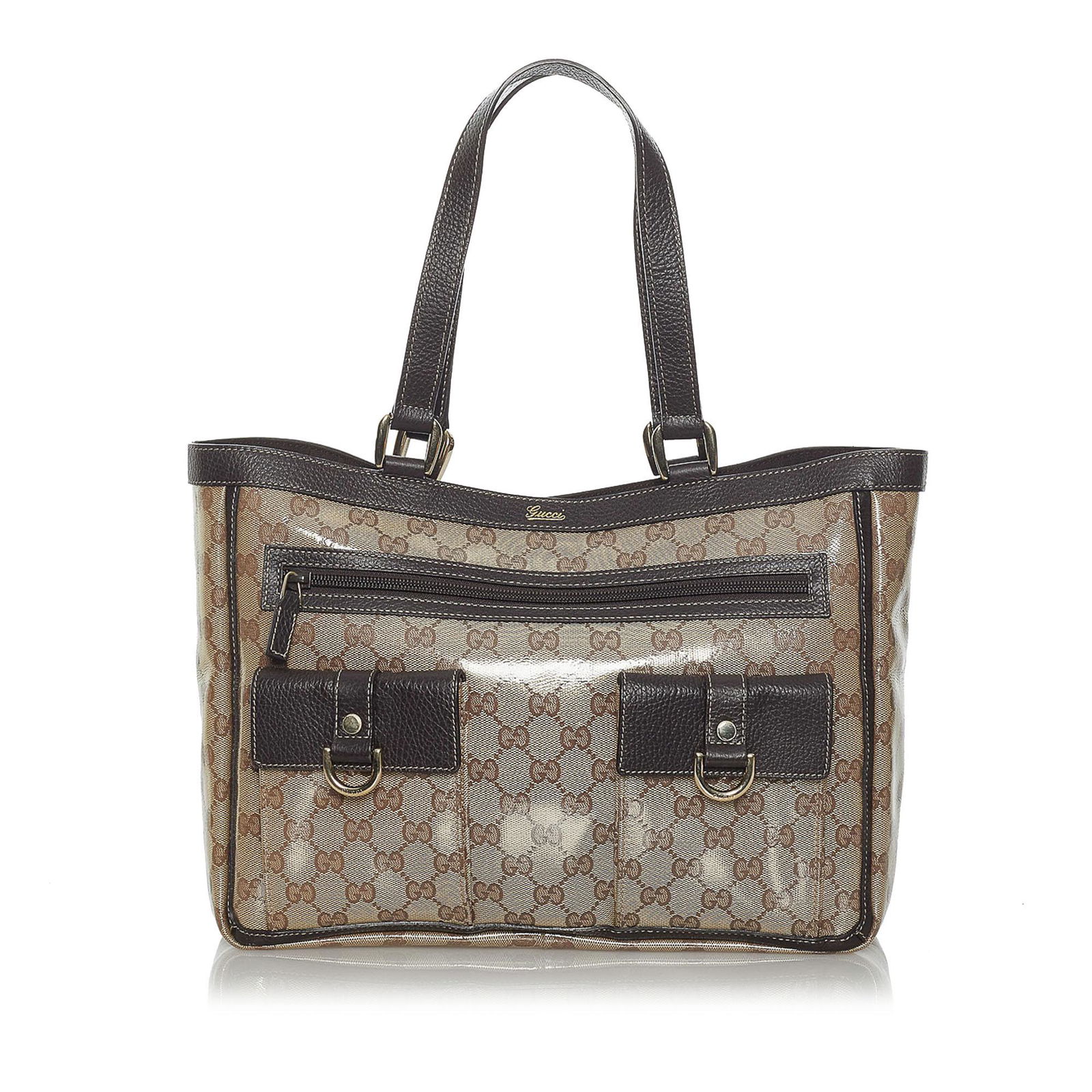 Gucci GG Crystal Abbey D Ring Tote Bag: Gucci GG Crystal Abbey D Ring Tote Bag This tote bag features a PVC body with leather trim flat leather straps exterior front zip and flap pockets an open top with magnetic snap button closure and int