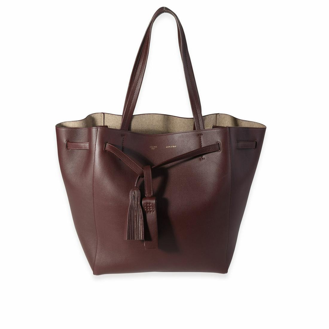 Celine Eggplant Leather Medium Cabas Phantom Tote: Celine Eggplant Leather Medium Cabas Phantom Tote Dimensions: 10.5 x 12 x 7 Handbag Accessories: Dustbag;Care Booklet;Retail Tag Bag Length: 10.5 in Bag Depth: 7 in Bag Height: 12 in Style: Bucket Bag