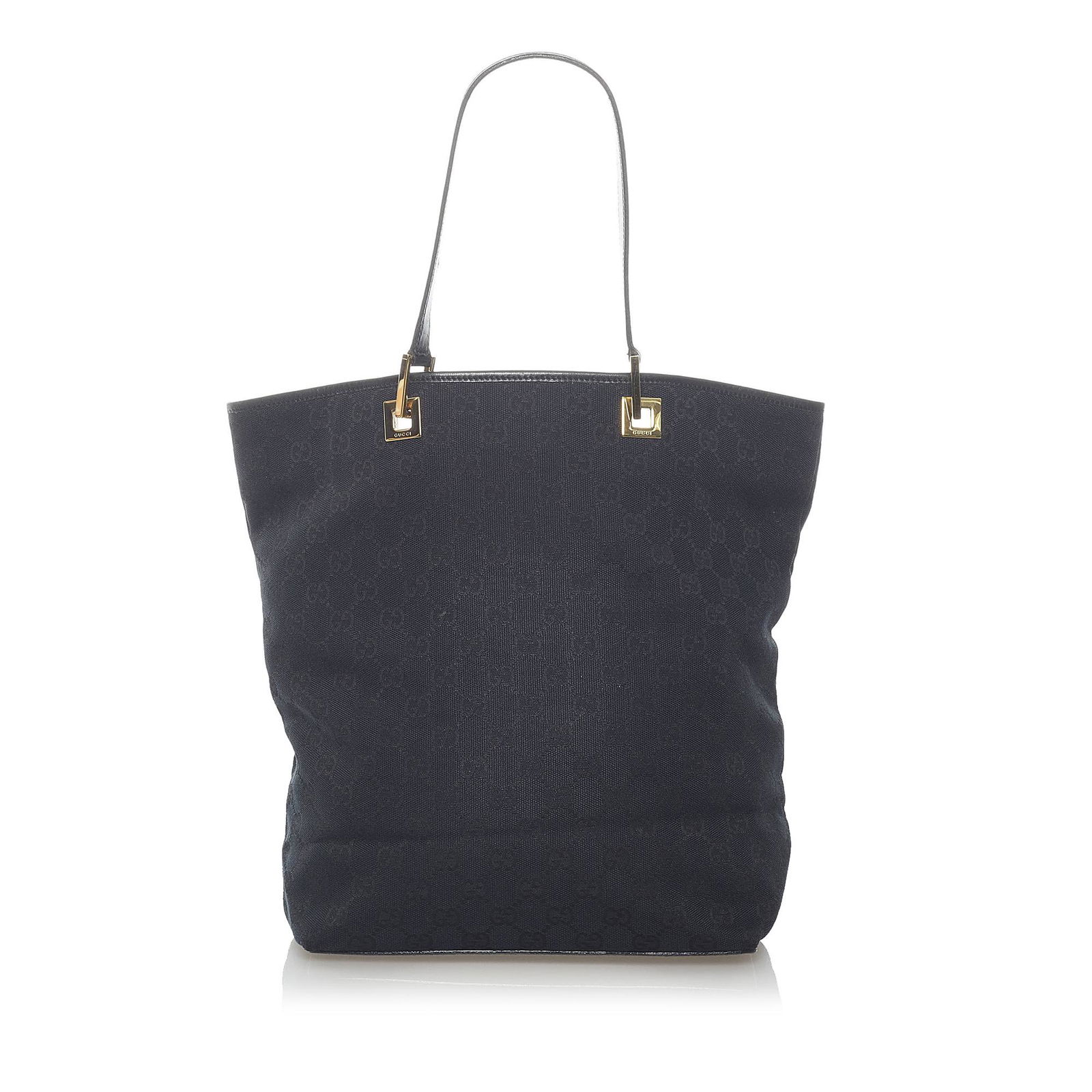 Gucci GG Canvas Tote Bag: Gucci GG Canvas Tote Bag This tote bag features a canvas body flat leather handles an open top and an interior zip pocket. Brand: Gucci Model: GG Canvas Tote Bag Origin: Italy Category: Bags Color: Bl