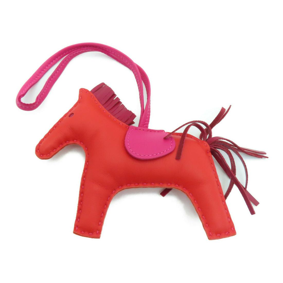 Hermes Rodeo MM Bag Charm Swift Leather Red Fuchsia: Hermes Rodeo MM Bag Charm Swift Leather Red Fuchsia Brand: HERMES Style: charm Material: Calfskin (cowhide) Color: Red Size Type: Regular Type: charm Frame Color: Red A+: Pristine The BIDHAUS Guarante