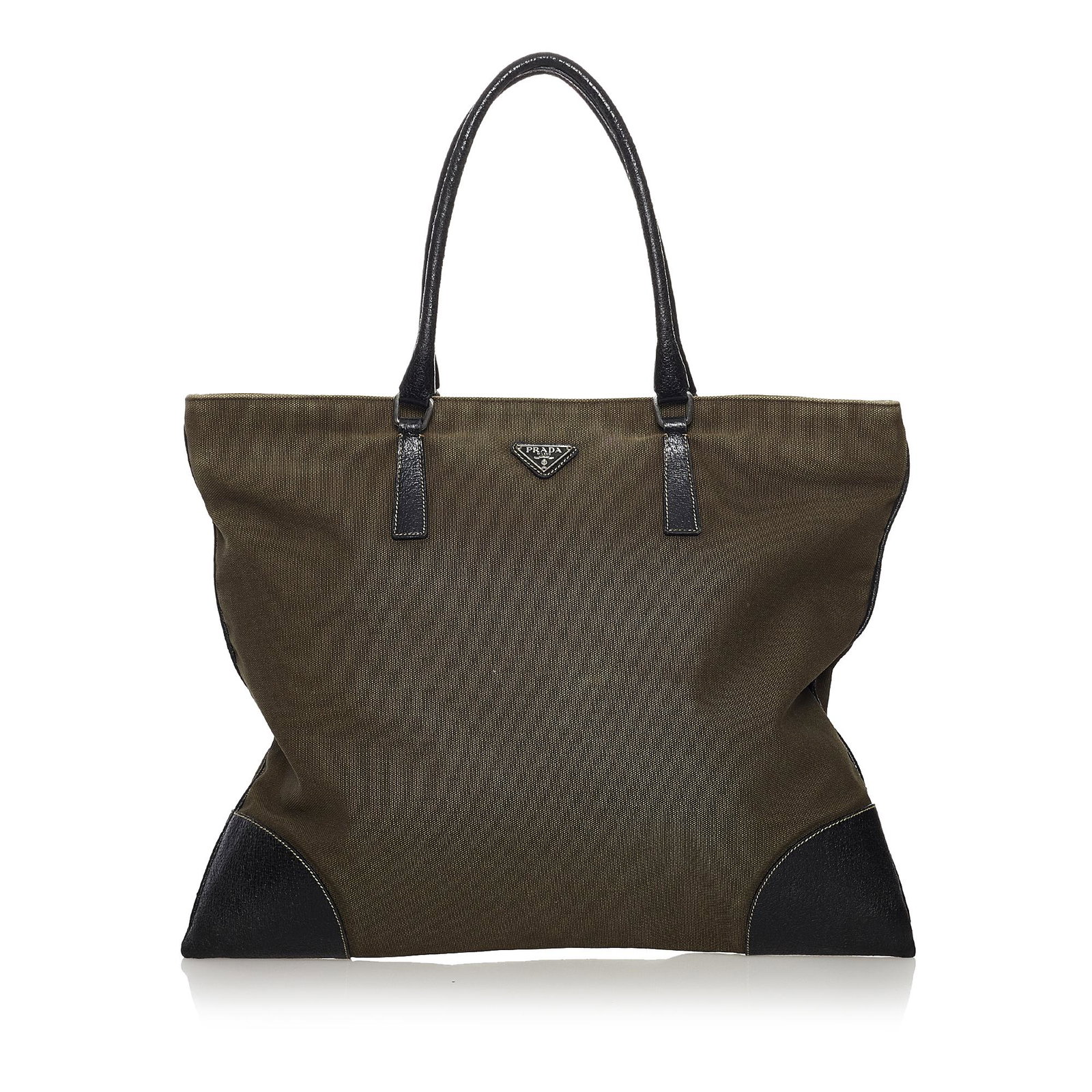Prada Canvas Tote Bag: Prada Canvas Tote Bag This tote bag features a canvas body with leather trim rolled leather handles an open top and an interior zip pocket. Brand: Prada Model: Canvas Tote Bag Origin: Italy Category: 