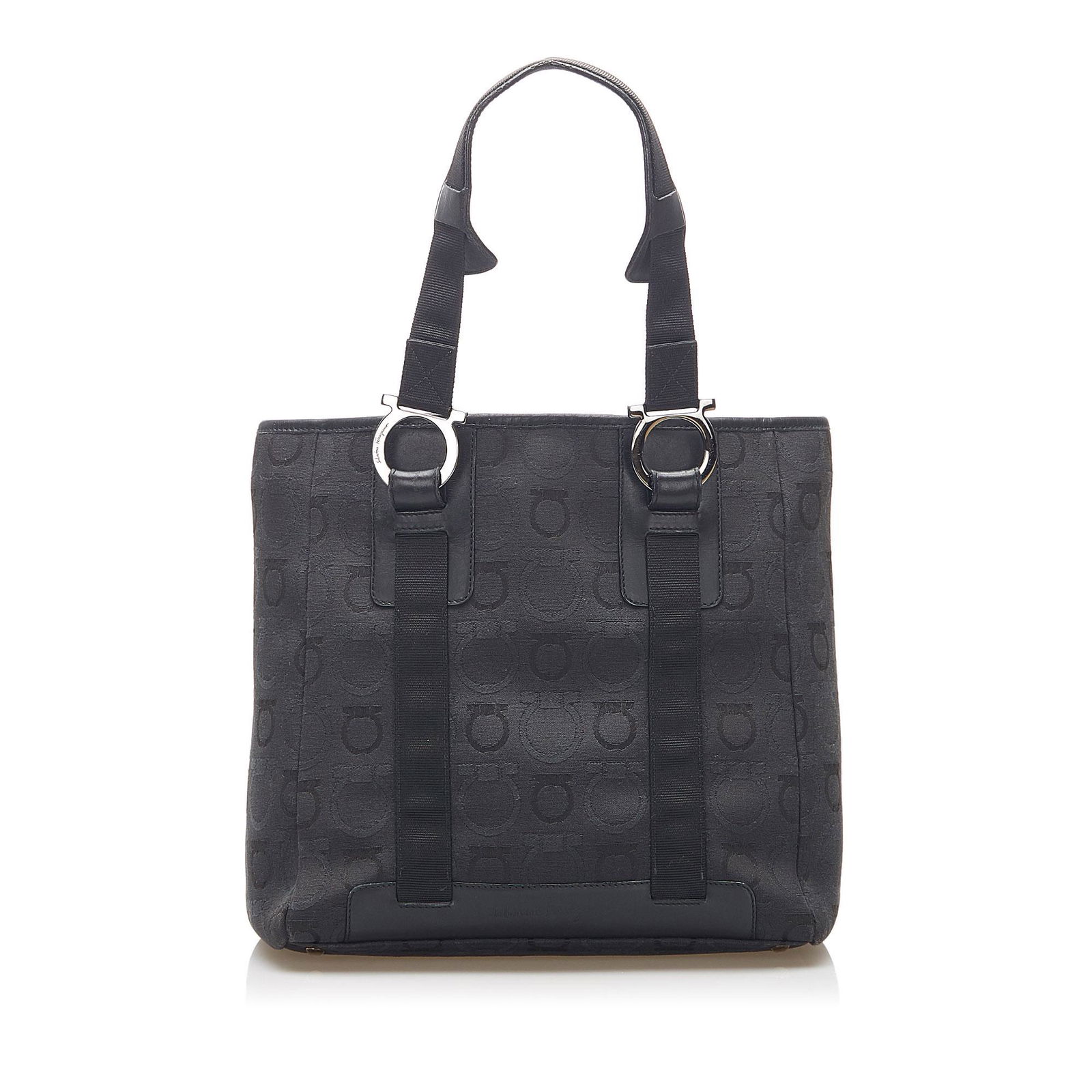Ferragamo Gancini Canvas Tote Bag: Ferragamo Gancini Canvas Tote Bag This tote bag features a canvas body with leather trim flat leather straps an open top and an interior slip and zip pockets. Brand: Ferragamo Model: Gancini Canvas To