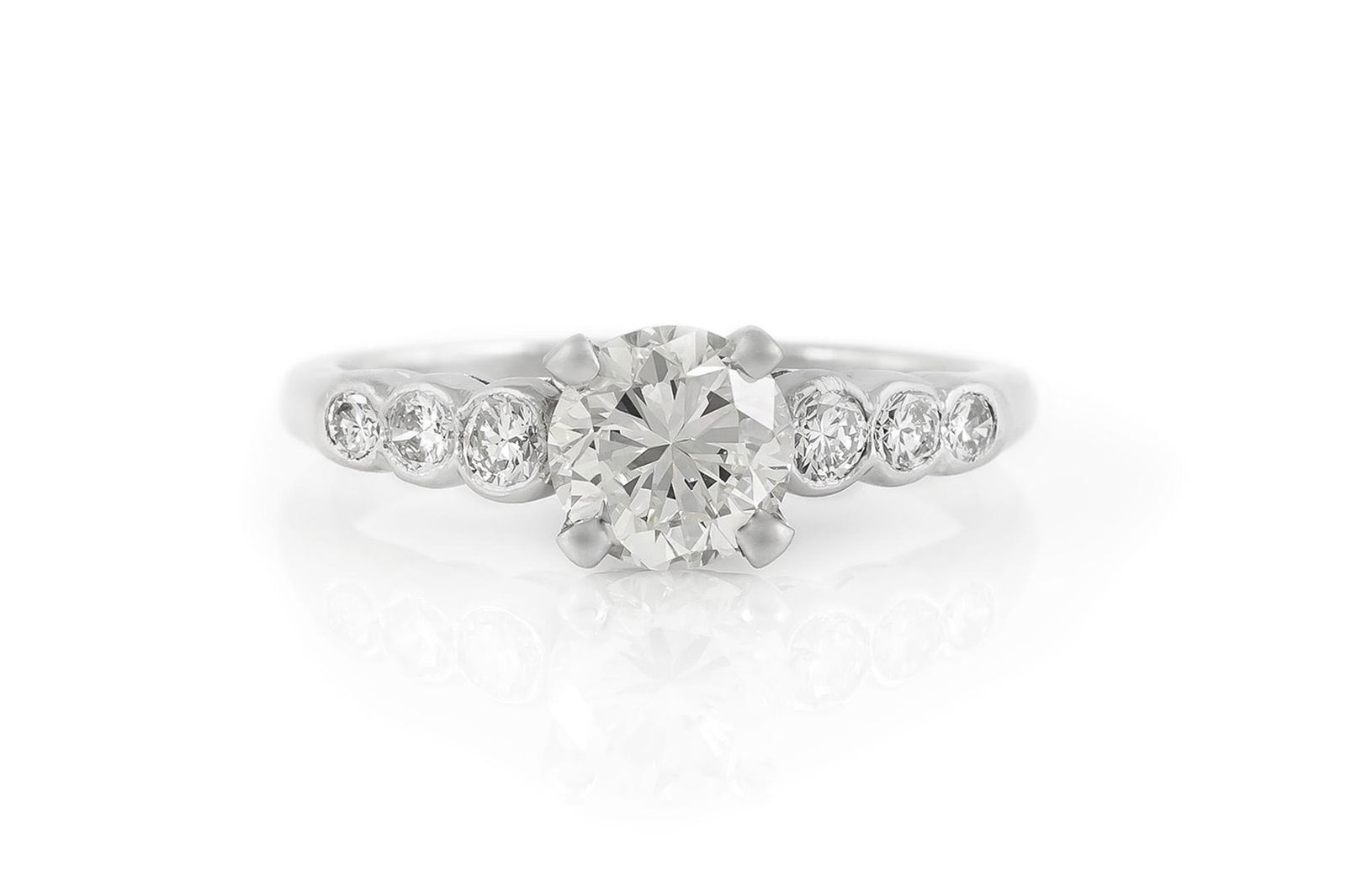 1.08 Carat Vintage Engagement Ring Vintage engagement ring finely crafted in platinum with: 1.08 Carat Vintage Engagement Ring Vintage engagement ring finely crafted in platinum with Transitional cut diamond at the center weighing 1.08 Carat. The center stone is flanked by 6 round brilliant