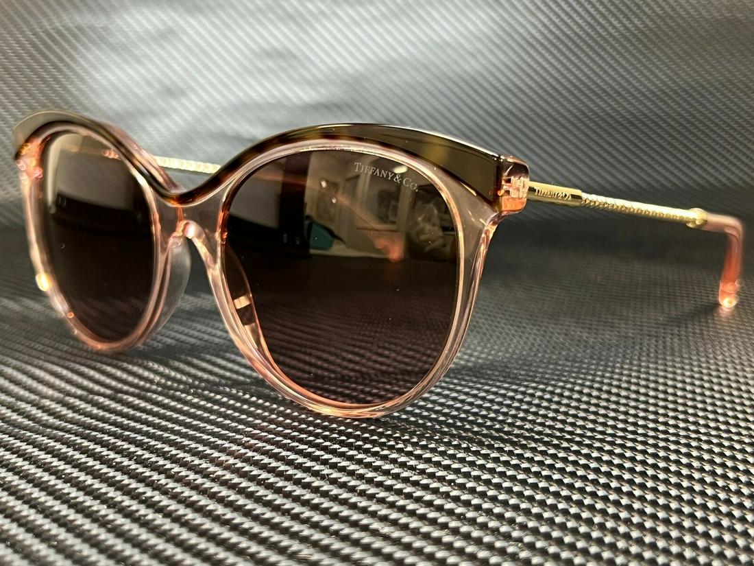 Tiffany TF4149 82909T Havana Pink Transparent Women's Butterfly Sunglasses 55-18: Tiffany TF4149 82909T Havana Pink Transparent Women's Butterfly Sunglasses 55-18 Brand: Tiffany & Co. Type: Sunglasses Frame Color: Pink New The BIDHAUS Guarantee: All items in this auction are guaran