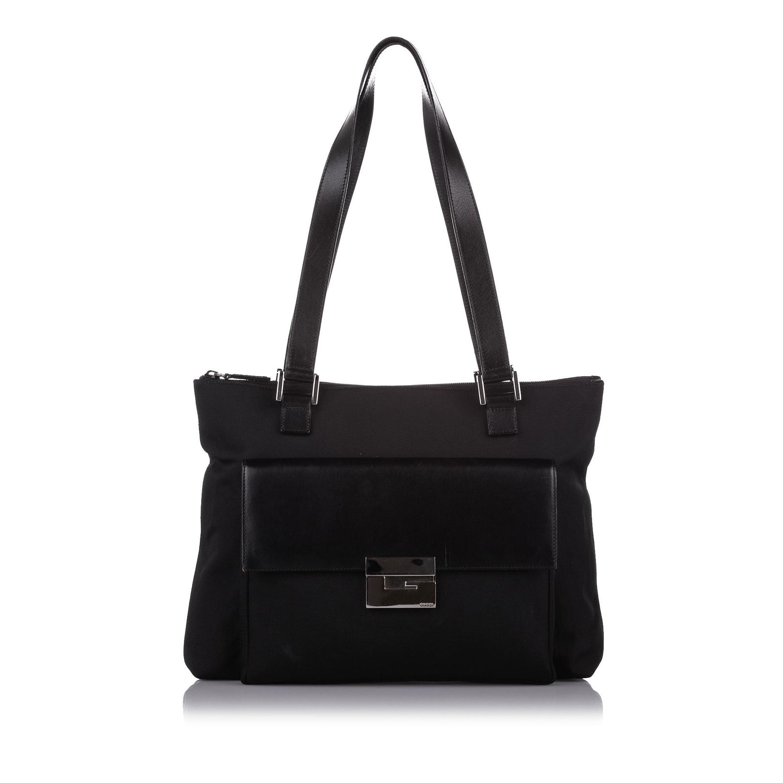 Gucci Canvas Tote Bag: Gucci Canvas Tote Bag This tote bag features a canvas body with leather trim an exterior front flap pocket with metal lock closure flat leather straps a top zip closure and an interior zip pocket. Bra