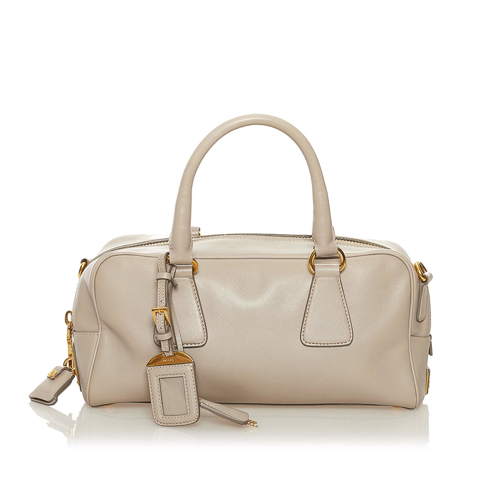 Prada Saffiano Satchel: Prada Saffiano Satchel This satchel features a leather body rolled leather handles a detachable strap a top zip closure and an interior zip pocket. Brand: Prada Model: Saffiano Satchel Origin: Italy C