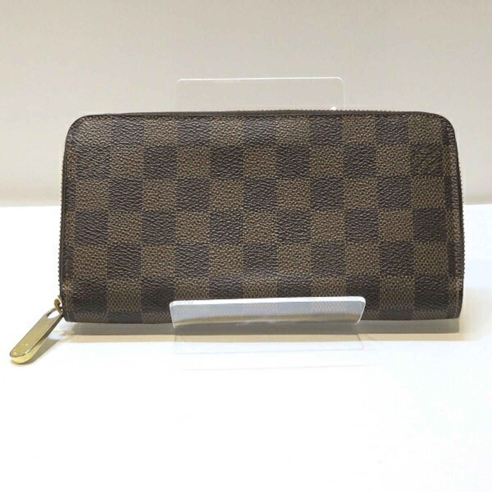 Louis Vuitton Damier Zippy Wallet N60015 Long Unisex: Louis Vuitton Damier Zippy Wallet N60015 Long Unisex Brand: Louis Vuitton Line: Damier Type: Long wallet (bi-fold) Gender: Unisex Color: Brown Damier Canvas Size (HxWxD): 10cm x 19.5cm x 2.5cm / 3.93