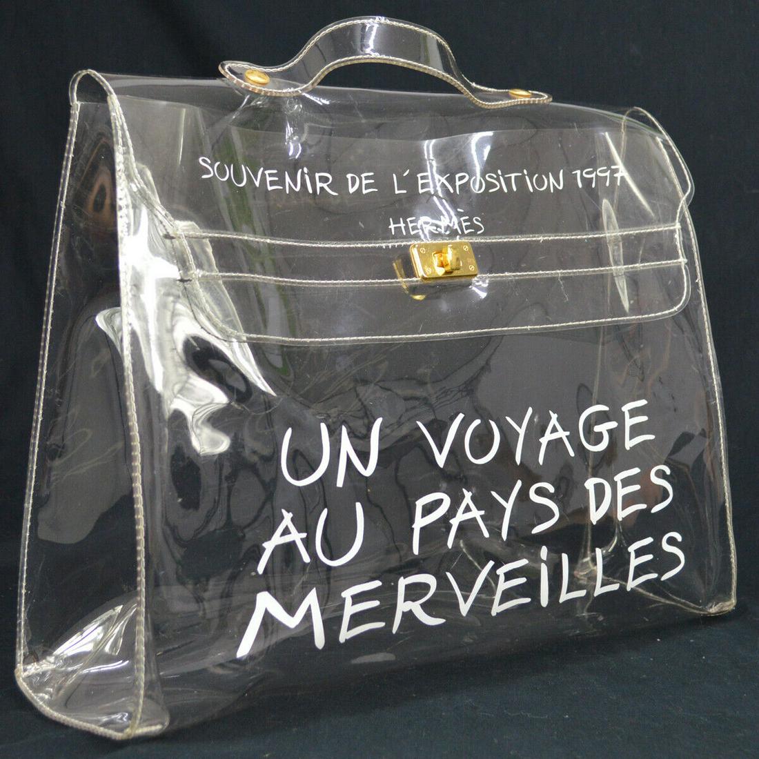 HERMES Vinyl Kelly Beach Hand Bag SOUVENIR DE L'EXPOSITION 1997: HERMES Vinyl Kelly Beach Hand Bag SOUVENIR DE L'EXPOSITION 1997 Exterior Color: Clear Strap Drop: 1.6 Exterior Material: Vinyl Bag Height: 12.2 Size: Medium Bag Width: 15.7 Bag Depth: 4.7 Brand: HERME
