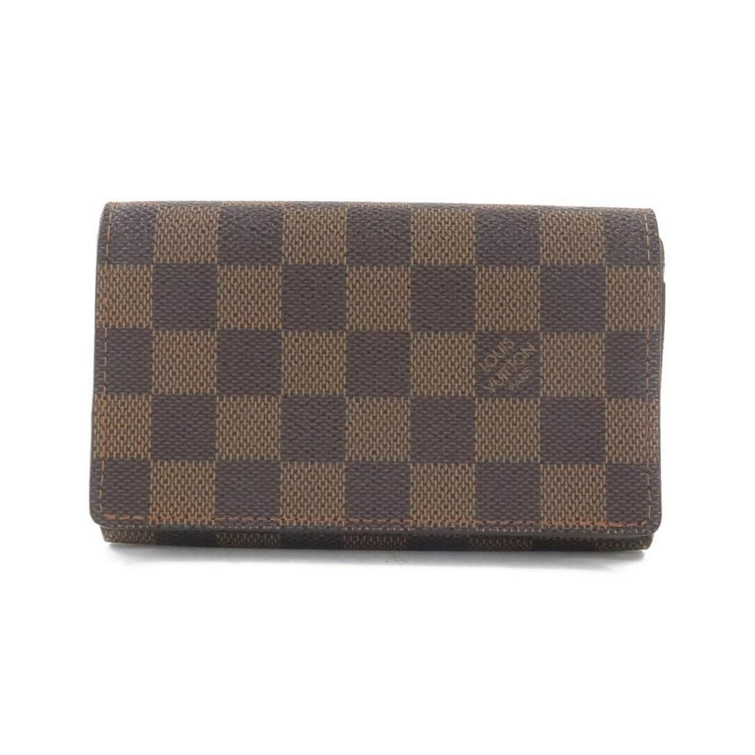 LOUIS VUITTON Damier Porte monnaie Tresor N61730 Wallet: LOUIS VUITTON Damier Porte monnaie Tresor N61730 Wallet Brand: LOUIS VUITTON Style: Purse Color: EBENE GOLD (Hardware) Material: Coated canvas Gender: Unisex Size: WxHxD: 14cmx9cmx3cm Type: Purse AB: 