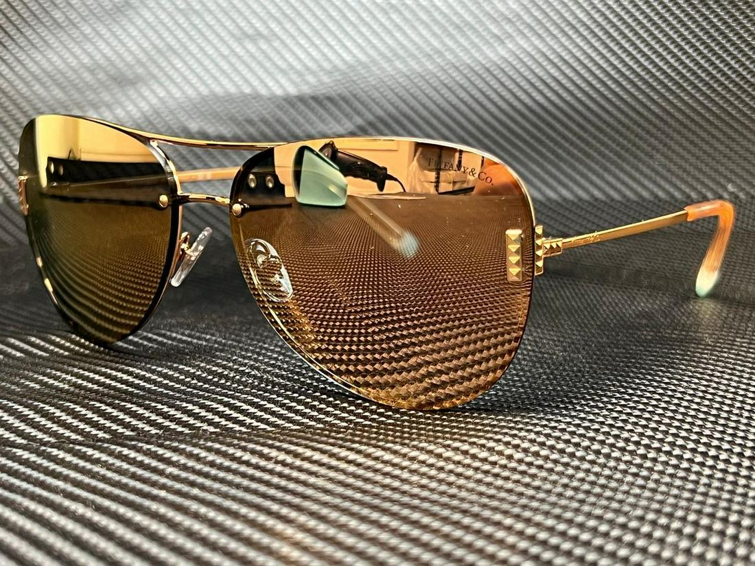 TIFFANY TF3066 61054Z Rubedo Mirror Rose Gold Women's Sunglasses 62 mm: TIFFANY TF3066 61054Z Rubedo Mirror Rose Gold Women's Sunglasses 62 mm Year Manufactured: 2020-2029 Lens Technology: Gradient Mirrored Anti-Reflective Vintage: No Brand: Tiffany & Co. Frame Color: Gol