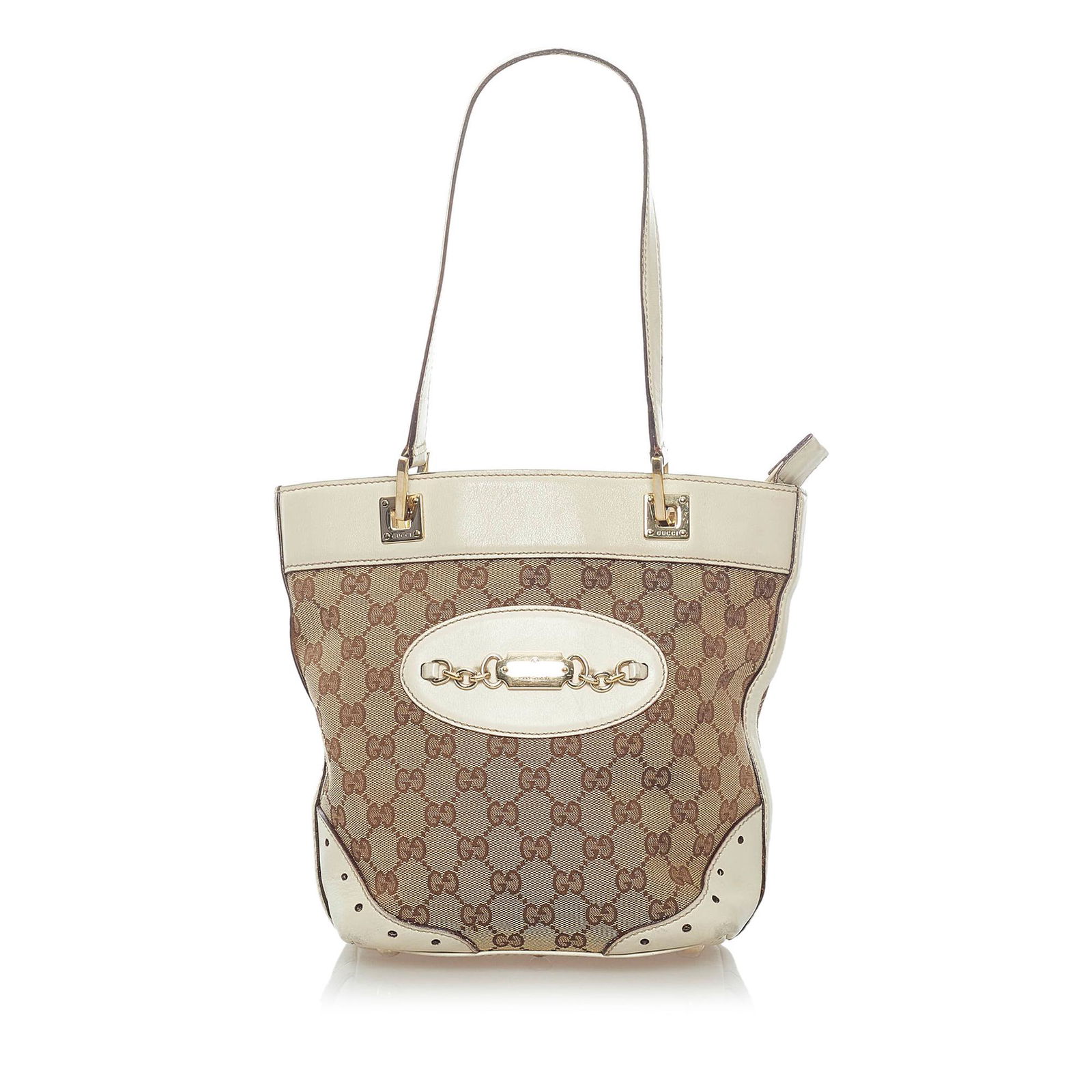 Gucci GG Canvas Punch Tote Bag: Gucci GG Canvas Punch Tote Bag The Punch tote features a canvas body with leather trim flat leather straps a top zip closure and interior zip and slip pockets. Brand: Gucci Model: GG Canvas Punch Tote