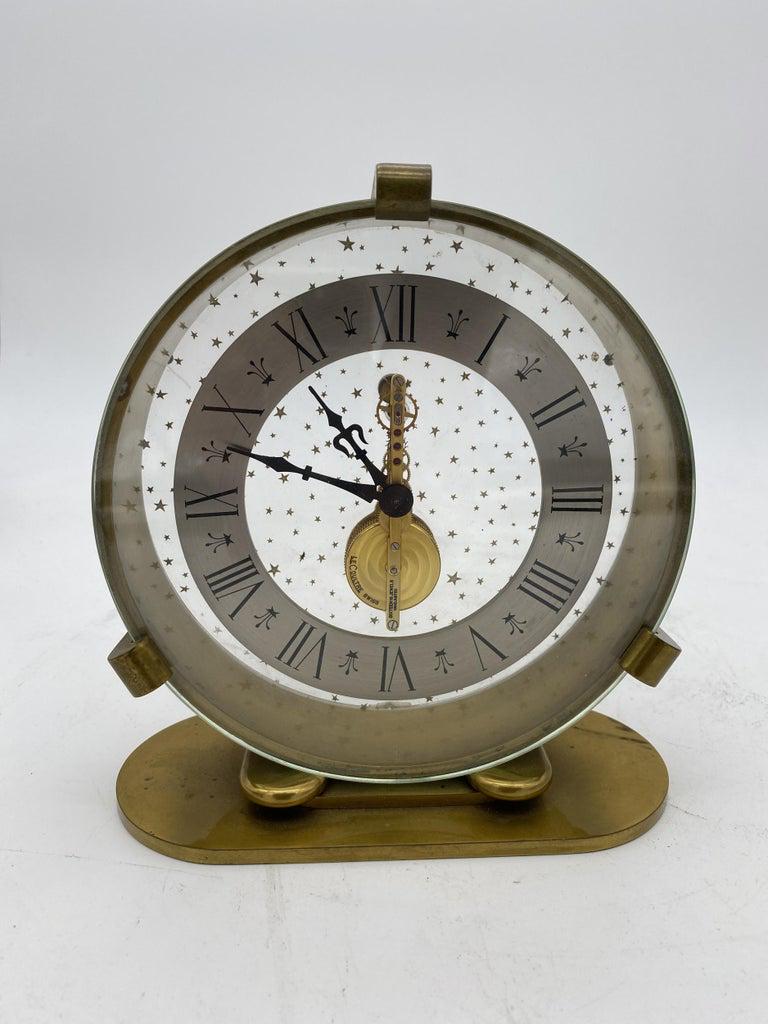 Jaeger Lecoultre 8 Days Inline Table Gold Table Clock w/ Star Dial circa 1967: Jaeger Lecoultre 8 Days Inline Table Gold Table Clock w/ Star Dial circa 1967 Creator: Jaeger-LeCoultre (Maker) Dimensions: Height: 7 in (17.78 cm) Dimensions: Width: 7 in (17.78 cm) Dimensions: Depth