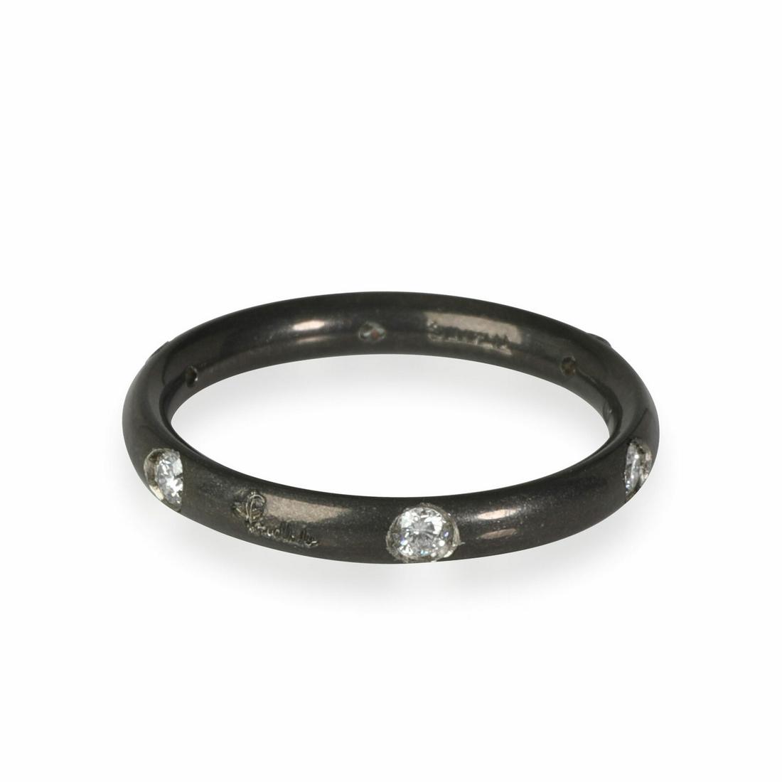 Pomellato Lucciole Diamond Band in Titanium 0.13 CTW: Pomellato Lucciole Diamond Band in Titanium 0.13 CTW Side Stone Shape: Round Side Stone Type: Diamond Original Box?: No Side Stone Quality: VS Side Stone Weight (Cts): 0.13 Size: 3.75 Metal: Titanium