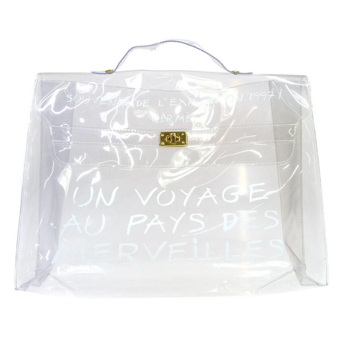 HERMES Vinyl Kelly Beach Handbag Purse SOUVENIR DE L'EXPOSITION 1997: HERMES Vinyl Kelly Beach Handbag Purse SOUVENIR DE L'EXPOSITION 1997 Size: Medium Accents: Logo Model: HERMES Kelly Handle/Strap Material: Vinyl Style: Satchel/Top Handle Bag Bag Height: 12.2 Exterior