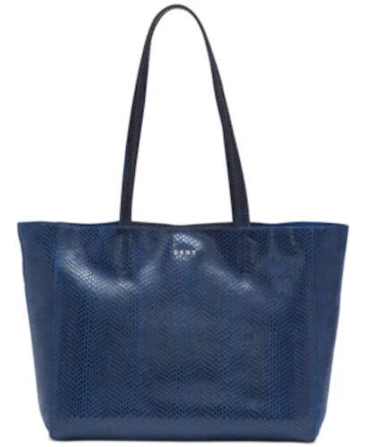 DKNY Blue Sally Leather East-West Tote Bag B3807: DKNY Blue Sally Leather East-West Tote Bag B3807 Exterior Color: Blue Exterior Material: Leather Model: Sally Brand: DKNY Style: Tote Pre-Owned The BIDHAUS Guarantee: All items in this auction are gua