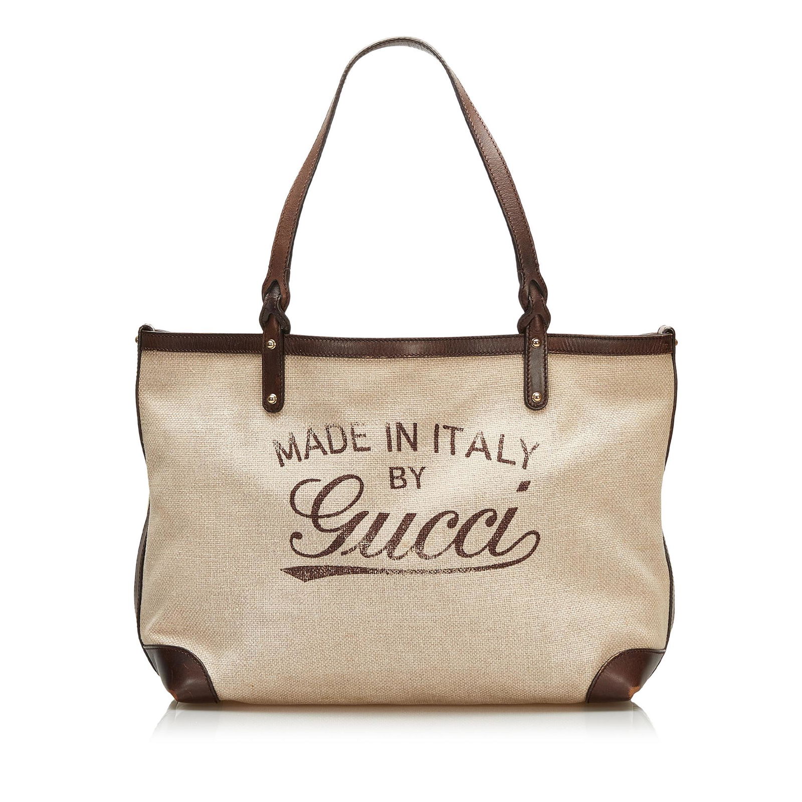 Gucci Craft Logo Tote Bag: Gucci Craft Logo Tote Bag The Craft tote bag features a canvas body with leather trim flat leather straps an open top with lobster claw closure and interior zip and slip pockets. Brand: Gucci Model: C