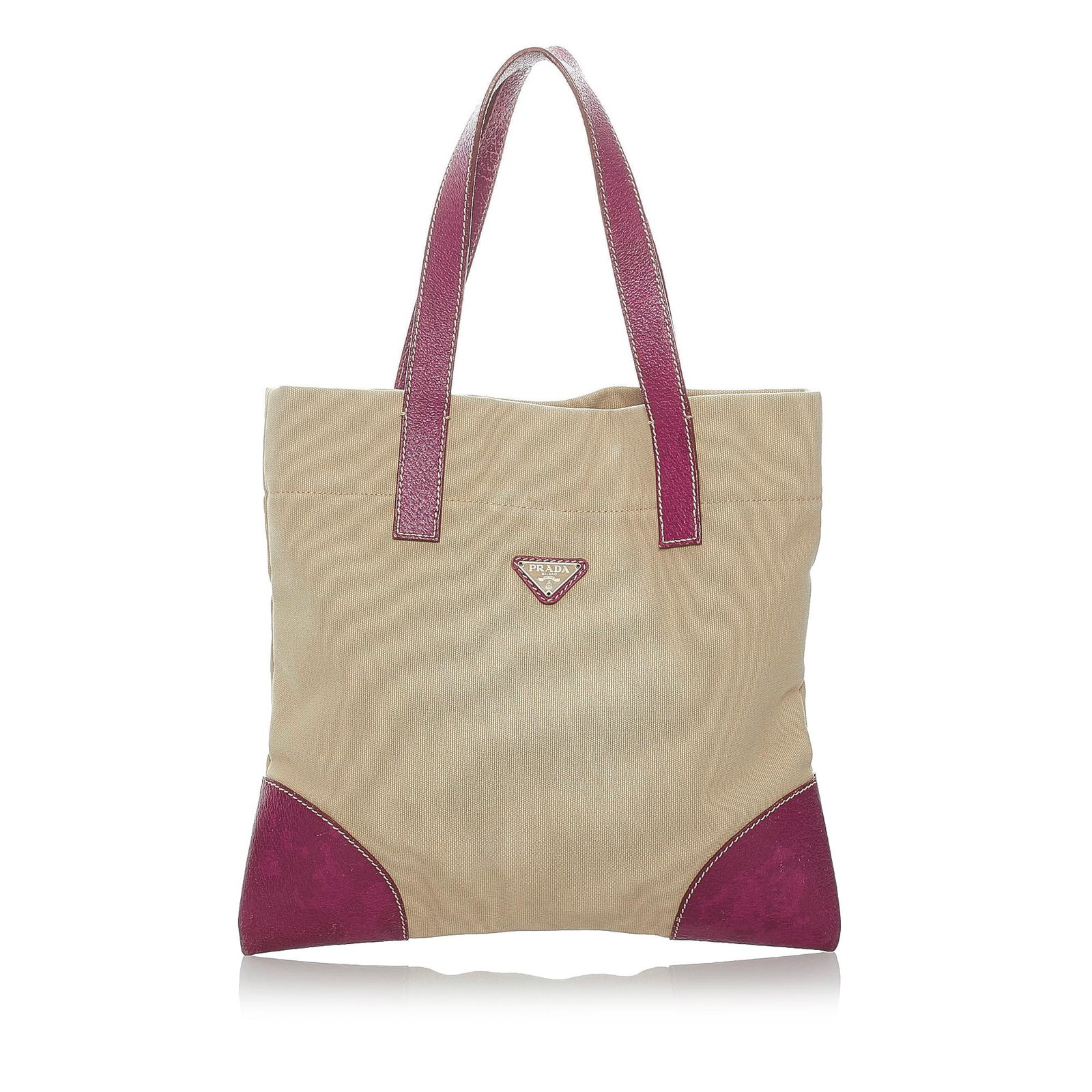 Prada Canvas Tote Bag: Prada Canvas Tote Bag This tote bag features a canvas body with leather trim flat leather handles a top zip closure and an interior zip pocket. Brand: Prada Model: Canvas Tote Bag Origin: Italy Catego