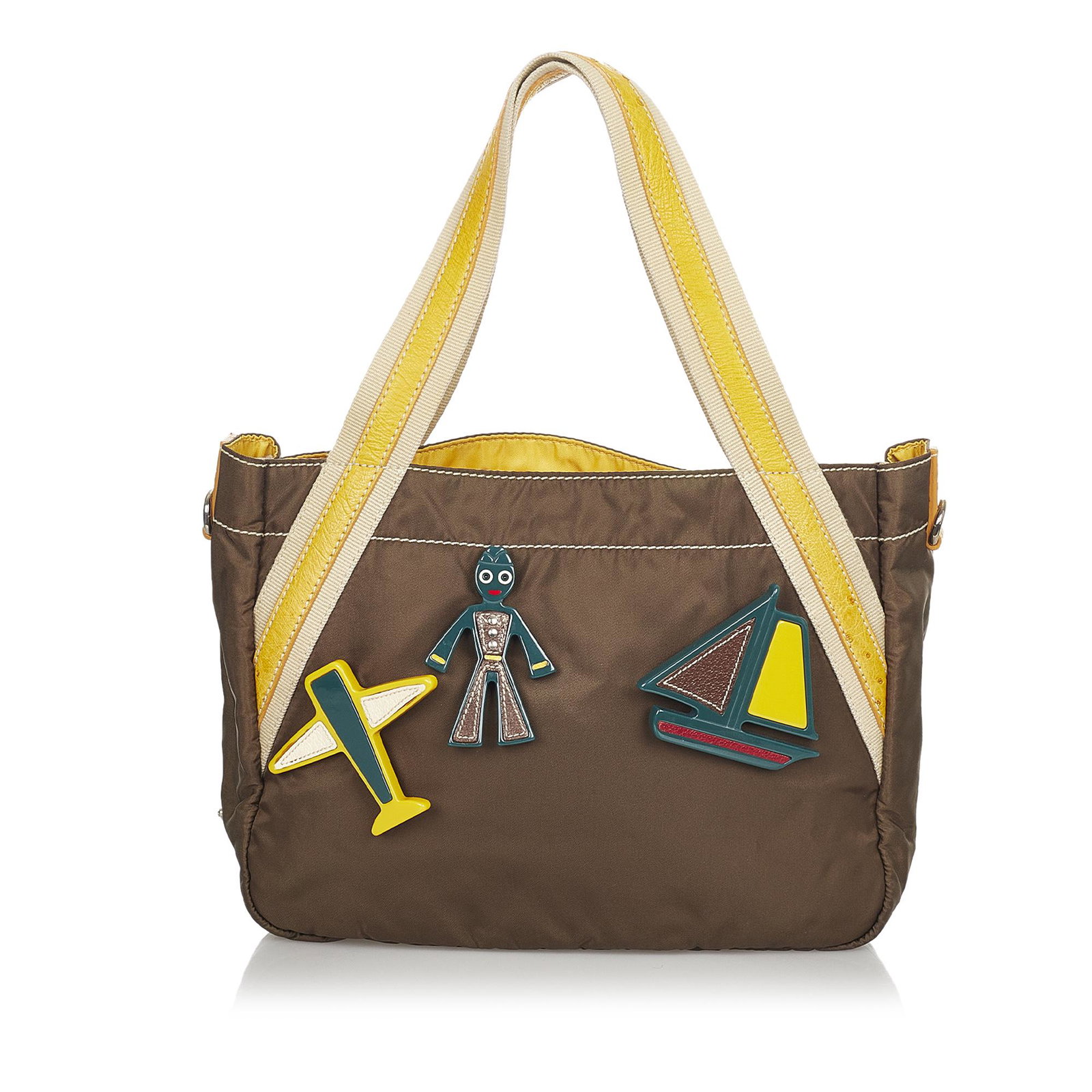 Prada Tessuto Handbag: Prada Tessuto Handbag This handbag features a nylon body with leather trim and appliques flat leather handles an open top and an interior zip pocket. Brand: Prada Model: Tessuto Handbag Origin: Italy 