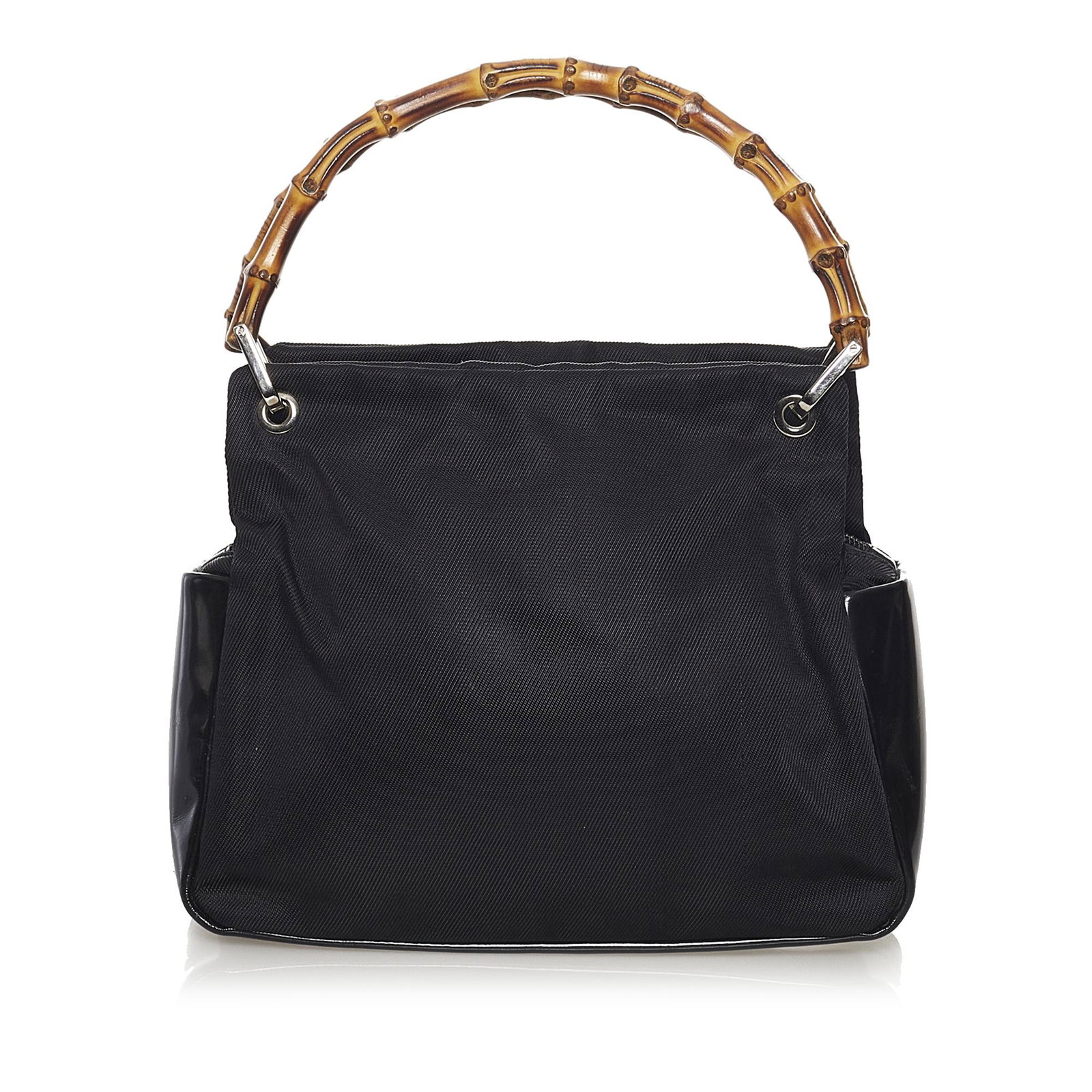 Gucci Bamboo Nylon Handbag: Gucci Bamboo Nylon Handbag This handbag features a nylon body with leather trim bamboo top handles a top zip closure and an interior zip pocket. Brand: Gucci Model: Bamboo Nylon Handbag Origin: Italy