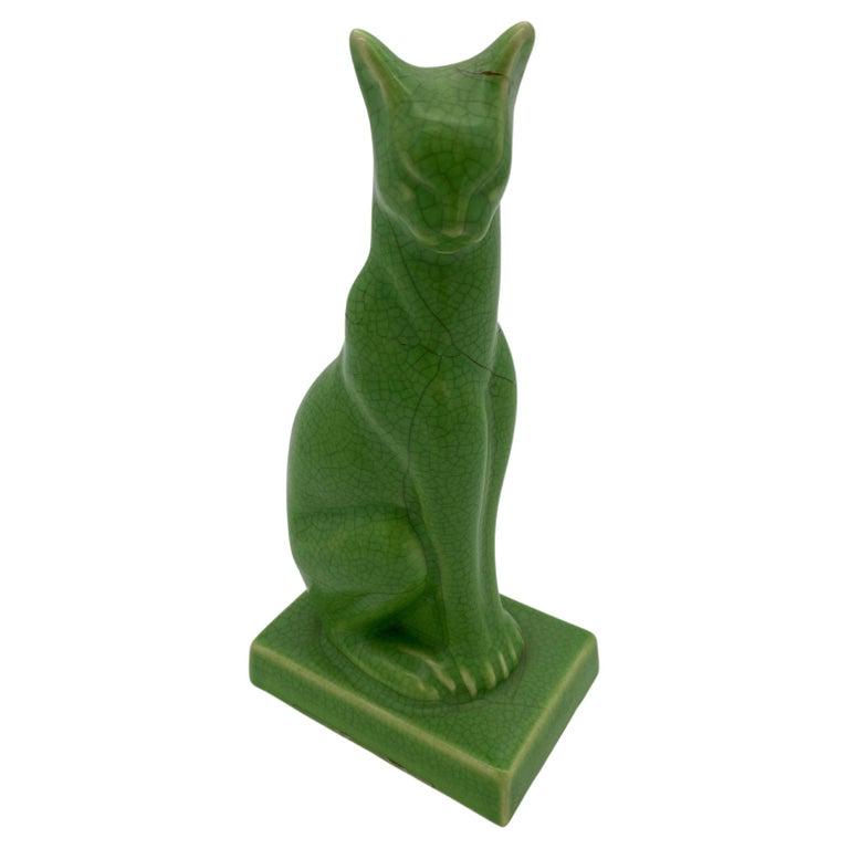 Egyptian Revival Art Deco Green Ceramic Bastet Cat Pair: Egyptian Revival Art Deco Green Ceramic Bastet Cat Pair Dimensions: Height: 9 in (22.86 cm) Dimensions: Width: 3 in (7.62 cm) Dimensions: Depth: 4 in (10.16 cm) Sold As: Set of 2 Materials and Techniq
