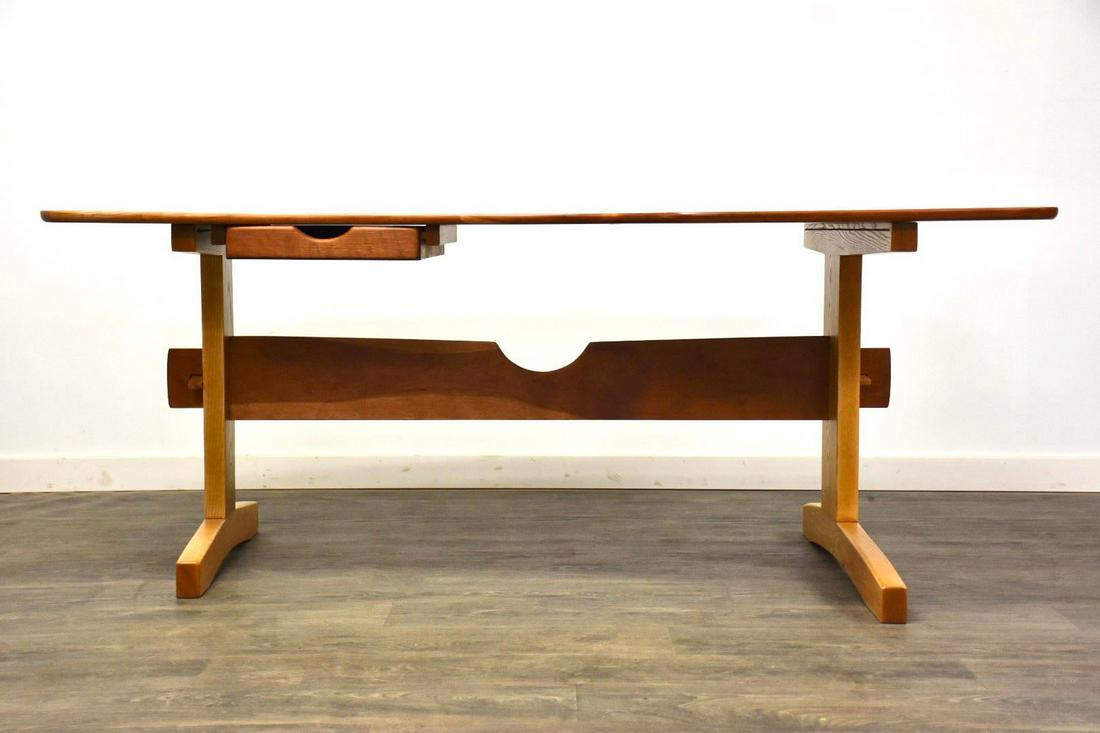 Solid Cherry and Oak Desk by l.e. Ross: Solid Cherry and Oak Desk by l.e. Ross A mid century modern style solid cherry and oak desk with a trestle base and a single drawer signed L.E. Ross. Professionally refinished. Additional matching sto