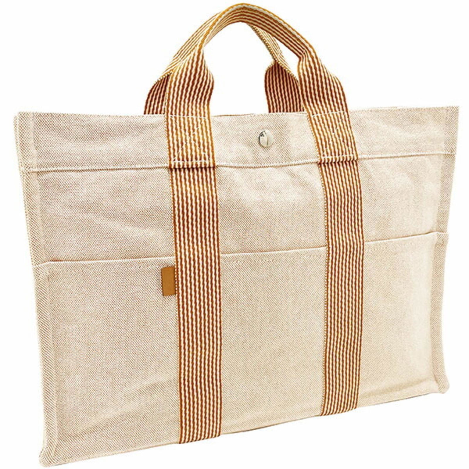 Hermes Tote Bag New Four Toe MM Canvas Orange HERMES Handbag Men's Women's Unisex: Hermes Tote Bag New Four Toe MM Canvas Orange HERMES Handbag Men's Women's Unisex Brand: Hermes Line: Kara Type: Handbag Tote bag Material: Canvas Canvas: Color: Orange Closure: Snap fastener Gender: