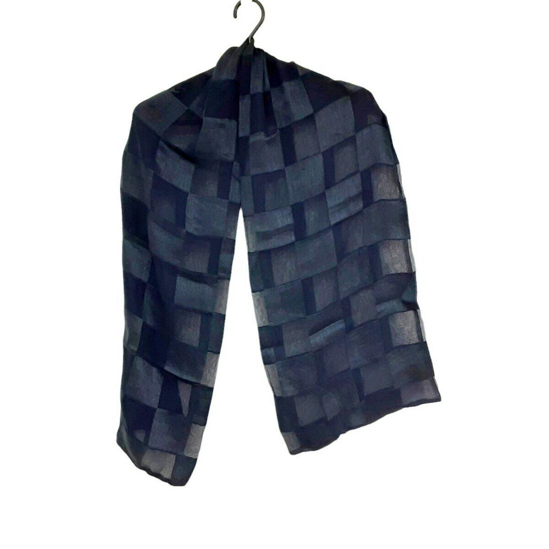 FENDI - Dark Navy Hemp Silk Scarf: FENDI - Dark Navy Hemp Silk Scarf Brand: FENDI Style: Scarf Color: Dark Navy Material: Hemp Silk Accessories: None Type: Scarf B: Reasonable Wear and Tear The BIDHAUS Guarantee: All items in this auct