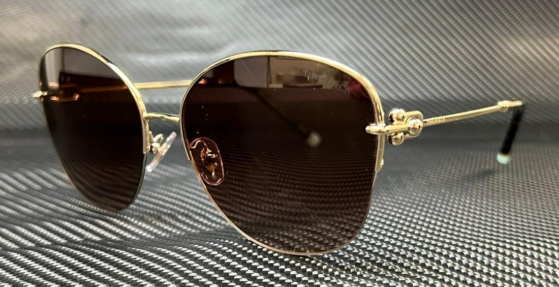 TIFFANY & co. TF3082 60213B Pale Gold Brown Grad Women's 58 mm Sunglasses: TIFFANY & co. TF3082 60213B Pale Gold Brown Grad Women's 58 mm Sunglasses Brand: Tiffany & Co. Frame Color: Brown Type: Sunglasses New The BIDHAUS Guarantee: All items in this auction are guaranteed t