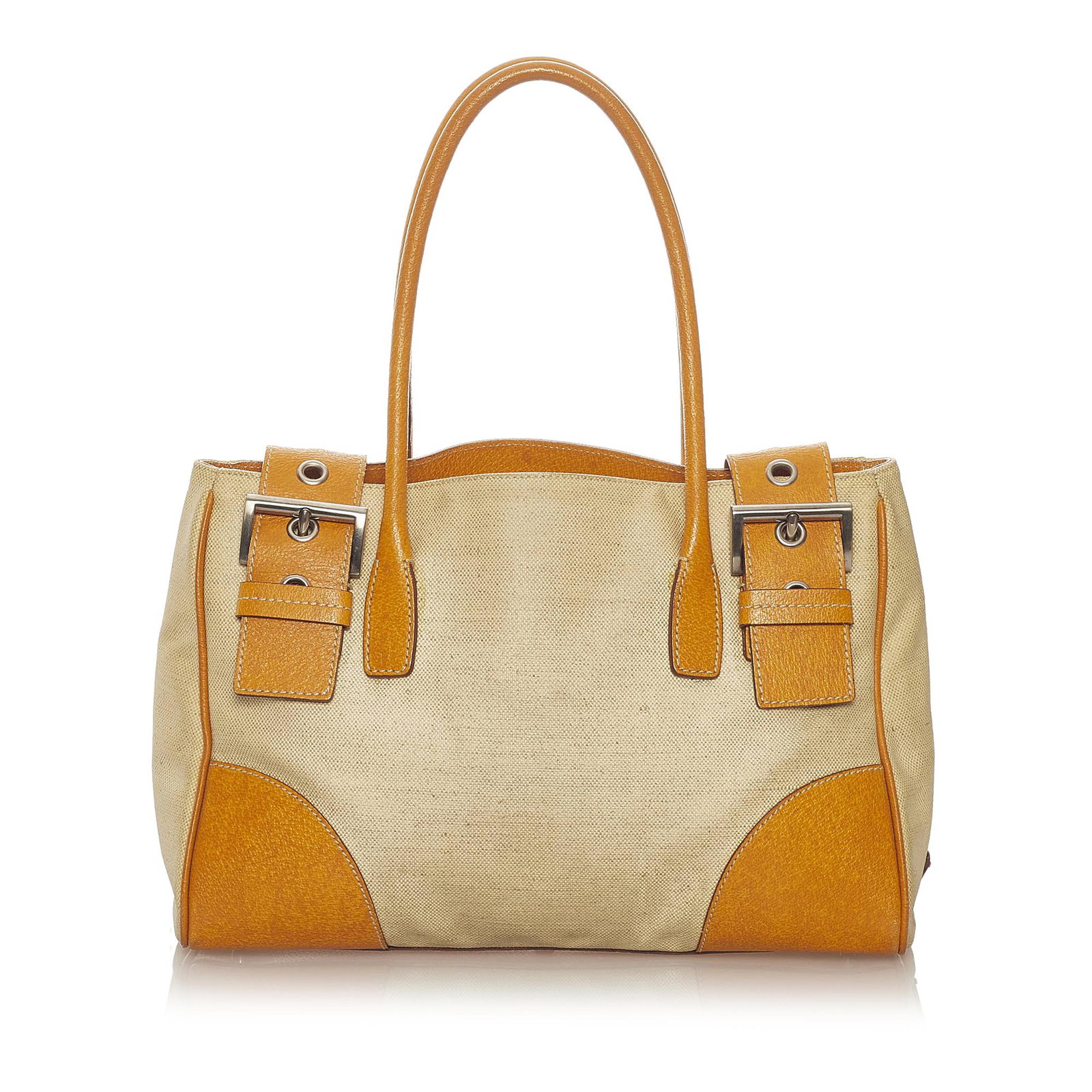 Prada Canvas Tote Bag: Prada Canvas Tote Bag This tote bag features a canvas body with leather trim rolled leather handles a top strap with buckle closure and interior zip and slip compartments. Brand: Prada Model: Canvas T