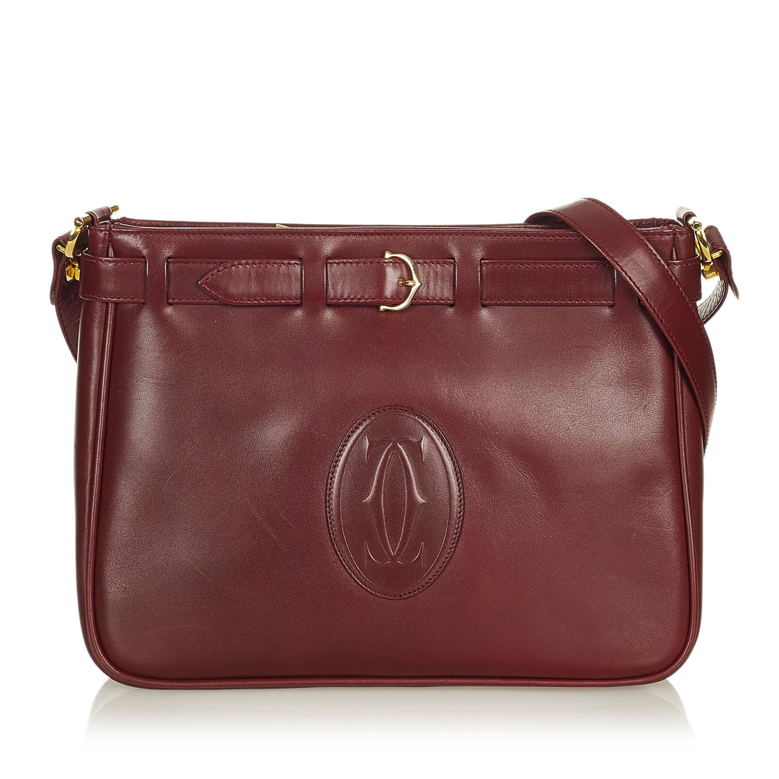 Must de Cartier Leather Crossbody Bag: Must de Cartier Leather Crossbody Bag This crossbody bag features a leather body a flat leather strap a top zip closure and interior open pockets. Brand: Cartier Model: Must de Cartier Leather Crossbo