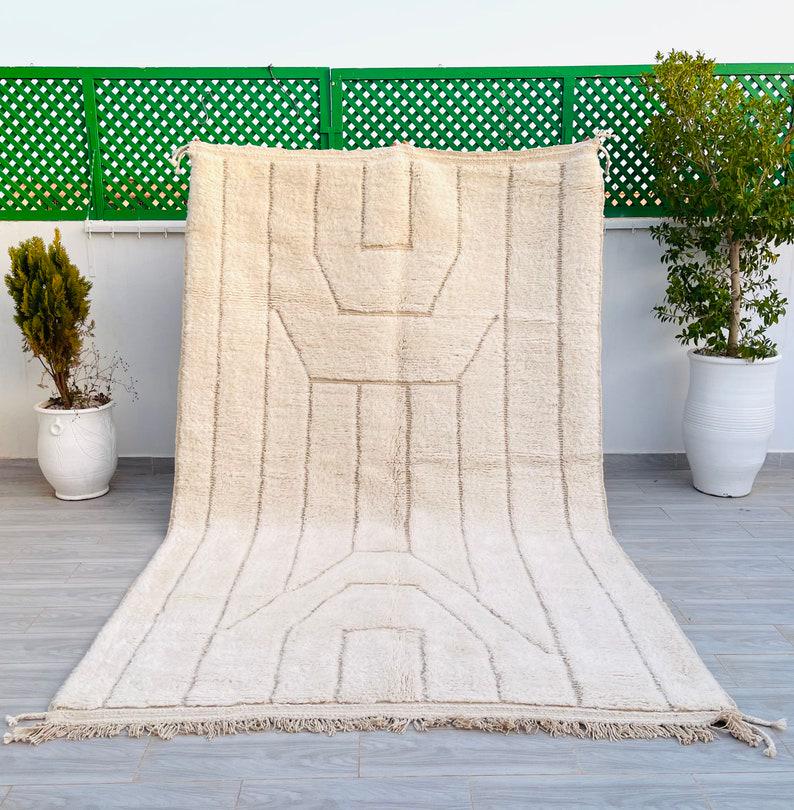Stunning Authentic Engraved Soft White Rug: Fabulous Authentic white Handmade Moroccan Berber Wool Rug, with engraved geometric pattern. This rug was handwoven in the Atlas Mountains by local Berber women weavers using traditional tools and nat