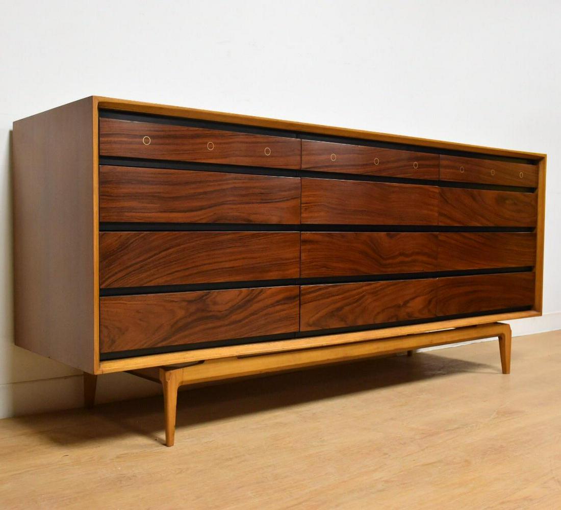 De Coene Freres Rosewood and Walnut Dresser: De Coene Freres Rosewood and Walnut Dresser A marvelous twelve drawer rosewood front dresser with circular brass inlay built around a walnut case designed by De Coene Freres made in Belgium. The black