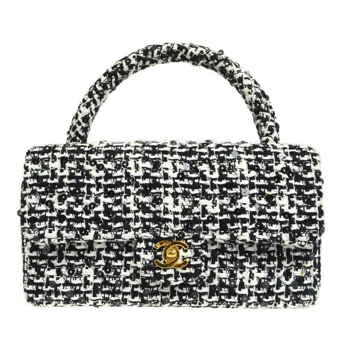 CHANEL Quilted CC Hand Bag Purse Tweed Sequins Vintage Black 2964539 (#0645L) on Mar 24, 2023 | Bidhaus in NY CHANEL Quilted CC Hand Bag Purse Tweed Sequins Vintage Black 2964539 (#0645L) on Mar 24, 2023 | Bidhaus in NY