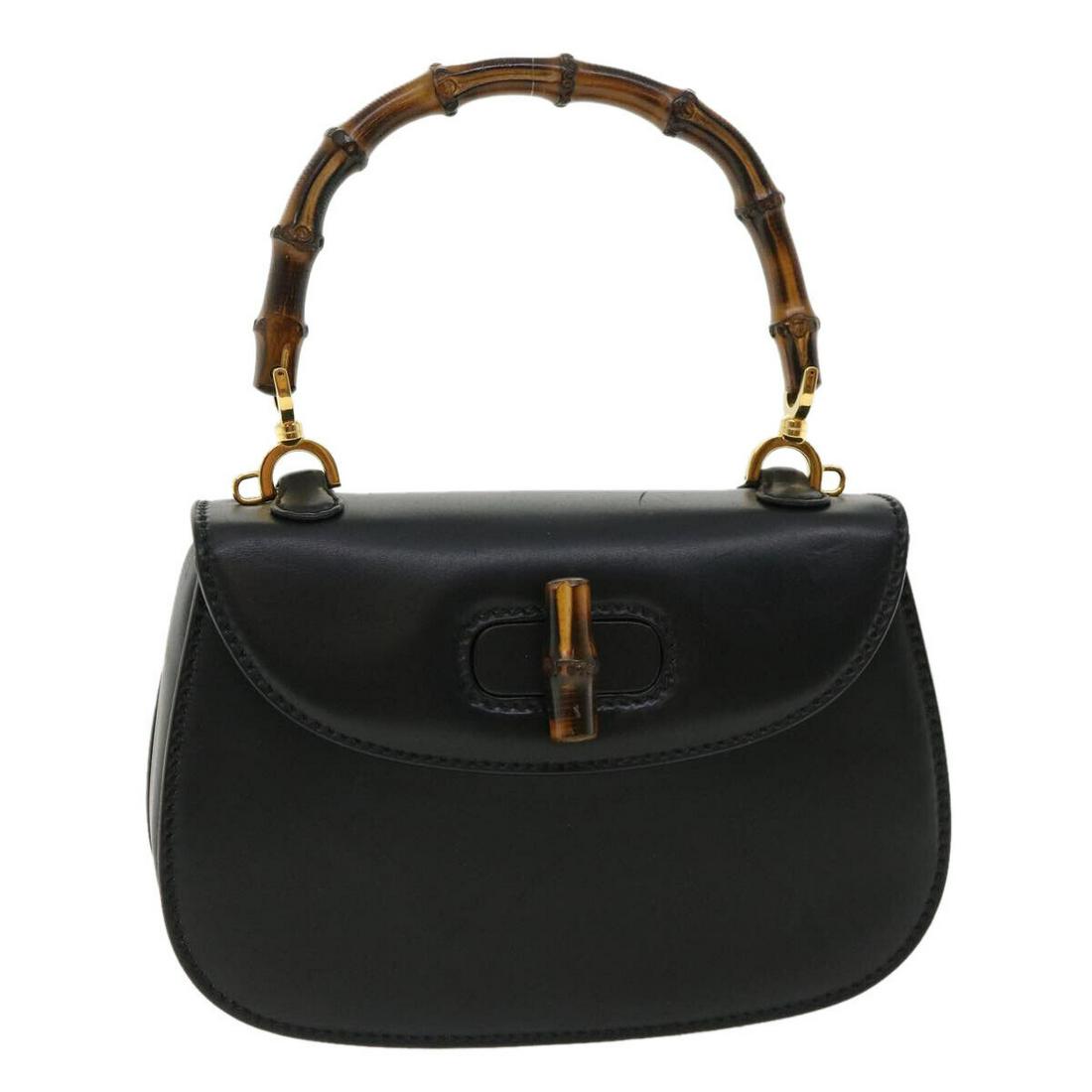 GUCCI Bamboo Hand Bag Leather Black: GUCCI Bamboo Hand Bag Leather Black Brand: GUCCI Style: Hand Bag Material: Leather Exterior Color: Black Bag Height: 5.3inch(Approx) / 13.5cm(Approx) Bag Depth: 2.8inch(Approx) / 7cm(Approx) Bag Lengt