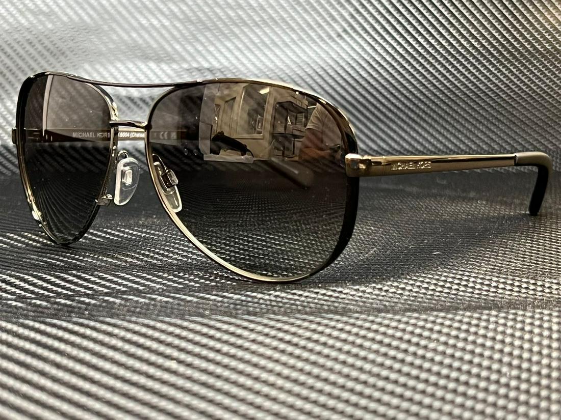 MICHAEL KORS MK5004 101311 Gunmetal/Black Pilot 59 mm Women's Sunglasses: MICHAEL KORS MK5004 101311 Gunmetal/Black Pilot 59 mm Women's Sunglasses Brand: Michael Kors Frame Color: Beige Type: Sunglasses New The BIDHAUS Guarantee: All items in this auction are guaranteed to