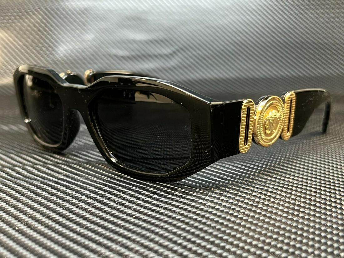 VERSACE VE4361 GB1 87 Black Gold Unisex Sunglasses 53 mm: VERSACE VE4361 GB1 87 Black Gold Unisex Sunglasses 53 mm Brand: Versace Frame Color: Black Uv Protection: UV400 Type: Sunglasses Lens Technology: Non-Polarized Style: Full Rim Frame Material: Nylon Le