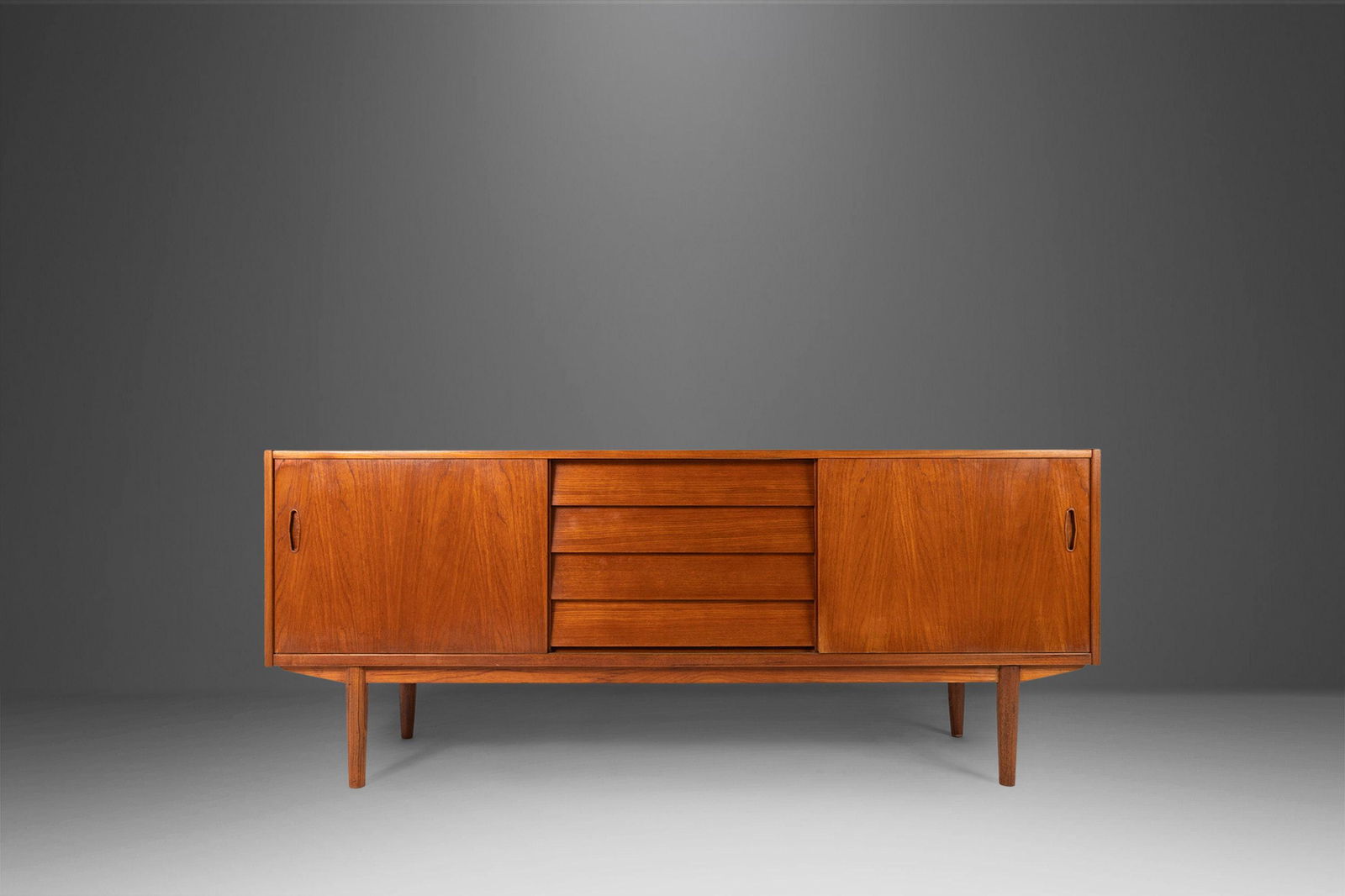 Mid Century Modern Credenza / Sideboard in Teak by Nils Jonsson for Hugo Troeds Sweden c. 1970s: Mid Century Modern Credenza / Sideboard in Teak by Nils Jonsson for Hugo Troeds Sweden c. 1970s Mid Century Modern Credenza / Sideboard in Teak by Nils Jonsson for Hugo Troeds Sweden c. 1970s About: A