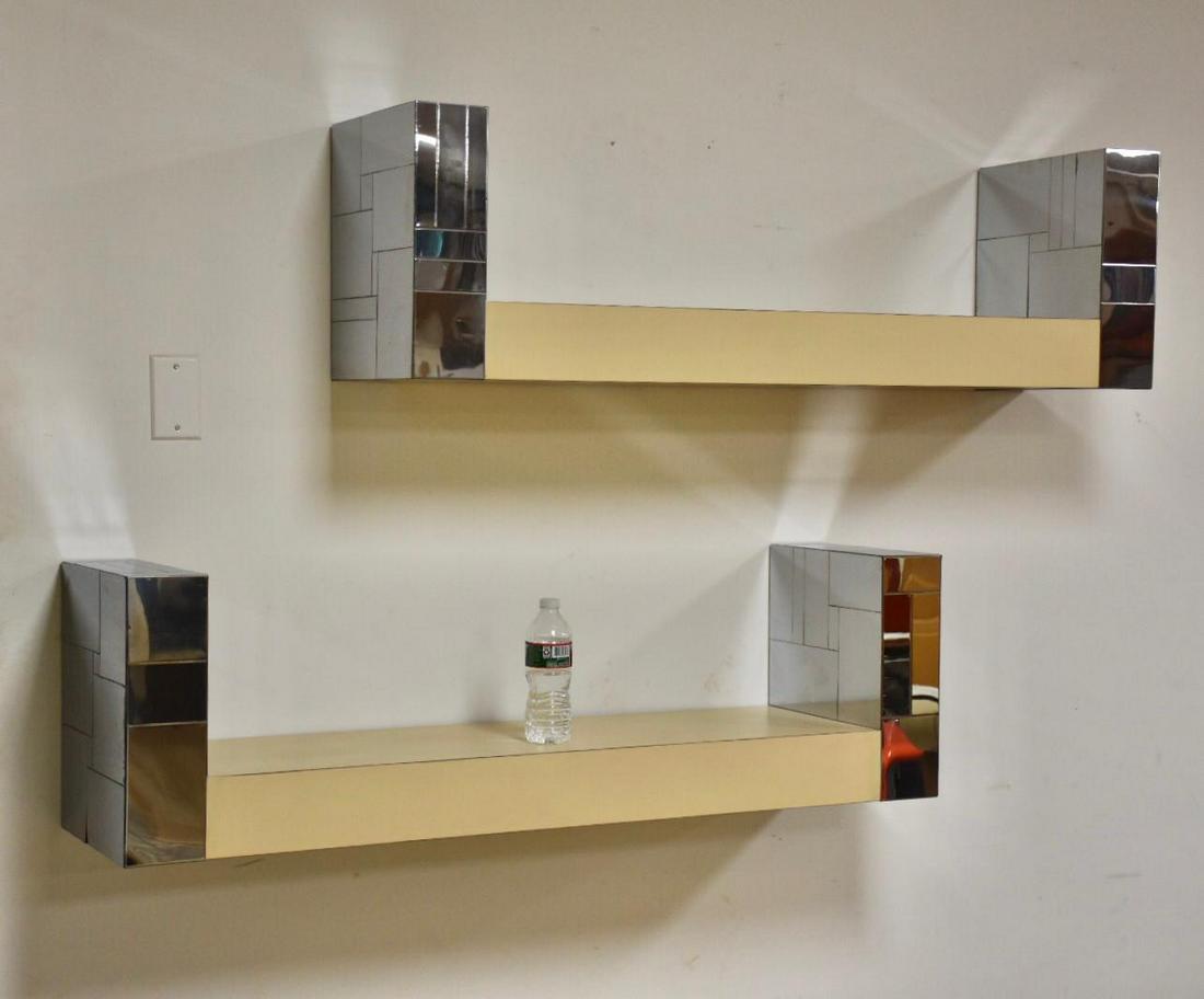 Paul Evans Cityscape Bookshelves- a Pair: Paul Evans Cityscape Bookshelves- a Pair A rare pair of mid century modern chrome and cream "Cityscape" wall mounting bookshelves designed and one signed by Paul Evans. 48" wide. 12" deep. 14" tall. D