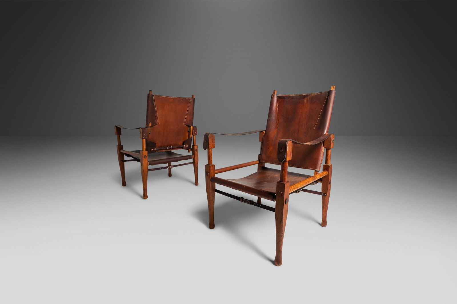 Set of Two (2) Safari Chairs by Wilhelm Kienzle for Wohnbedarf in Original Patinaed Leather: Set of Two (2) Safari Chairs by Wilhelm Kienzle for Wohnbedarf in Original Patinaed Leather Switzerland c. 1950's Set of Two (2) Safari Chairs by Wilhelm Kienzle for Wohnbedarf in Original Patinaed Le