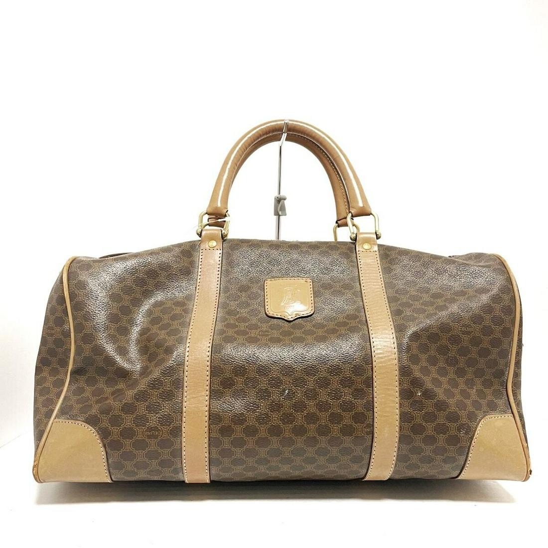 CELINE - Macadam Brown Beige PVC Boston Bag: CELINE - Macadam Brown Beige PVC Boston Bag Brand: CELINE Style: Boston Bag Exterior Color: Brown Beige Exterior Material: PVC Model Number: Macadam Accessories: None Type: Boston Bag C: Heavily Used