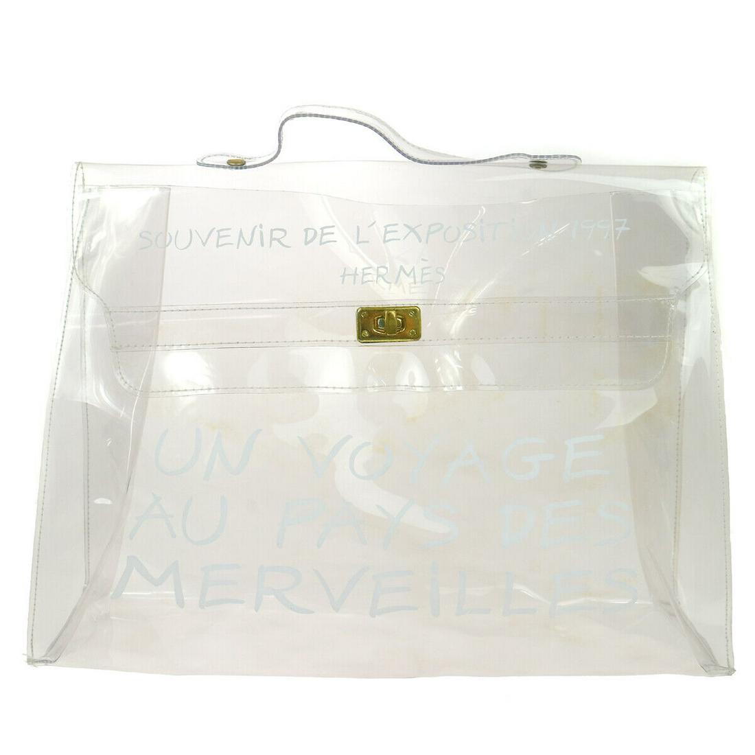 HERMES Vinyl Kelly Beach Hand Bag SOUVENIR DE L'EXPOSITION 1997: HERMES Vinyl Kelly Beach Hand Bag SOUVENIR DE L'EXPOSITION 1997 Size: Large Style: Hand Bag Bag Height: 12.2 Product Line: HERMES Kelly Exterior Material: Vinyl Exterior Color: Clear Closure: Flap Tur
