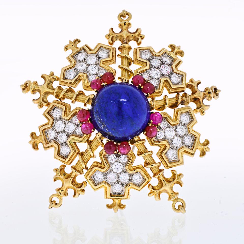 Tiffany & Co. 18K Yellow Gold Snowflake With Lapis Rubies And Diamonds Brooch: Tiffany & Co. 18K Yellow Gold Snowflake With Lapis Rubies And Diamonds Brooch Type: Brooches Metal: 18K Yellow Gold Grams: 46.9 Exact Diamond Weight: 5 Cts Measurements: W: 60mm Condition: Excellent.