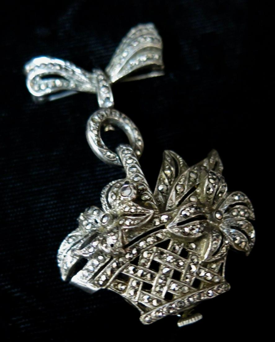 Vintage 1960's Marcasite/Sterling Silver Lapel Watch: Vintage 1960's Marcasite/Sterling Silver Lapel Watch Case Size: 25 mm Handmade: Yes With Service Records: No Case Color: Silver Vintage: Yes Case Material: Sterling Silver Water Resistance: Not Water
